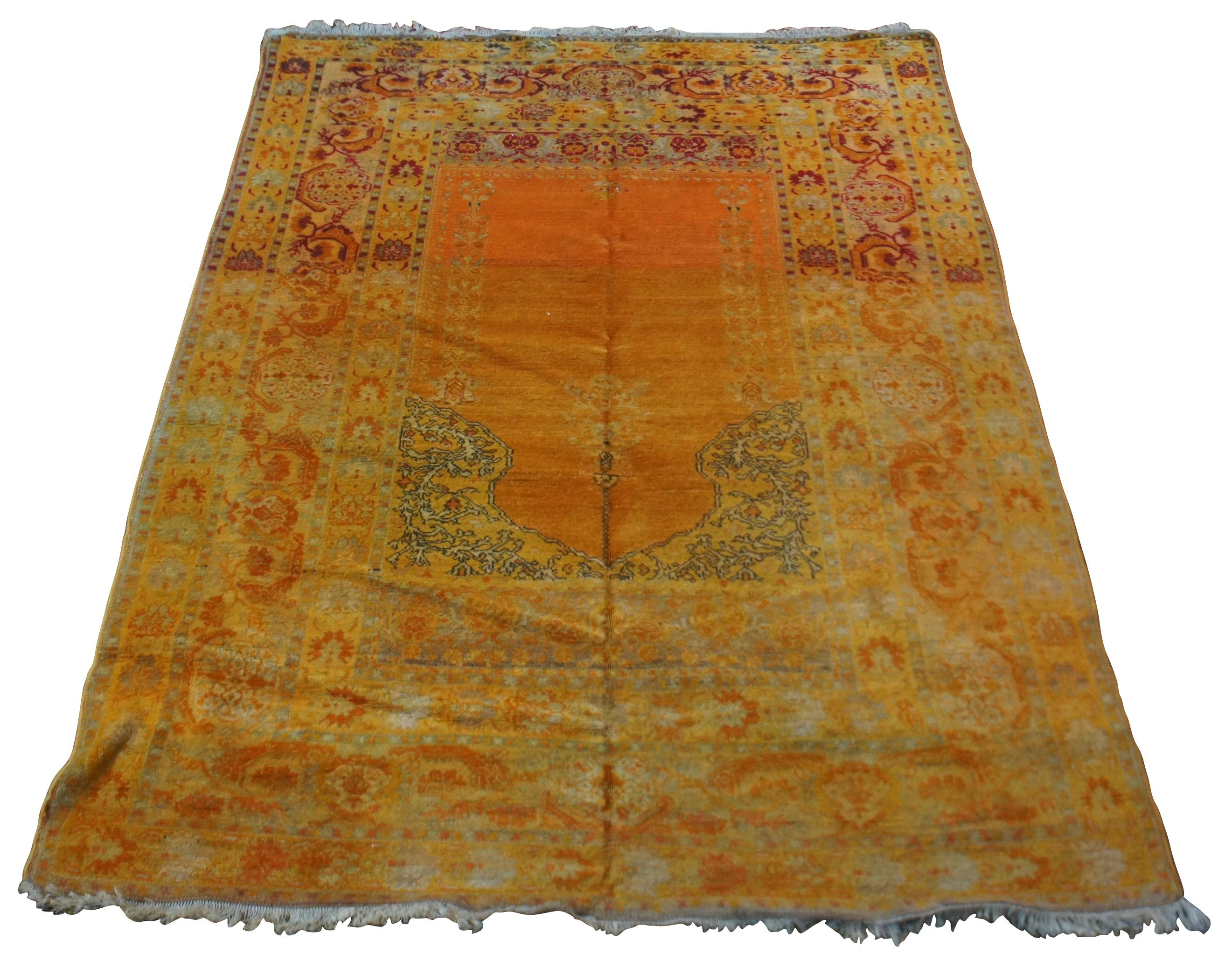 Antique Turkish wool prayer rug in shades of orange, yellow, and red.

Measures 69” x 51” / 5.75’ x 4.25’ (length x width).