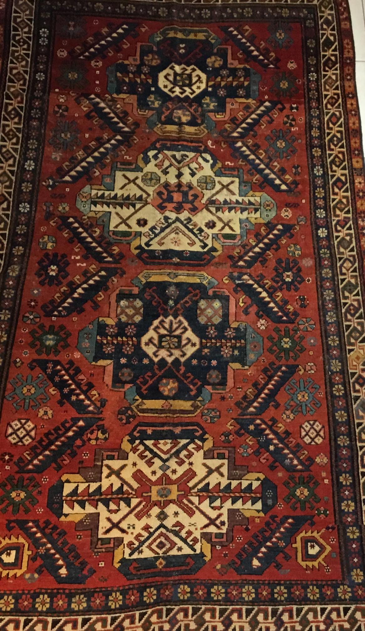 Beautiful antique handwoven Caucasian rug Russia made of wool
With intriguing geometric motifs of flowers all over. Four fantastic medallion in the center, and great vibrant antique colors that you will get them only with age. I present this rug