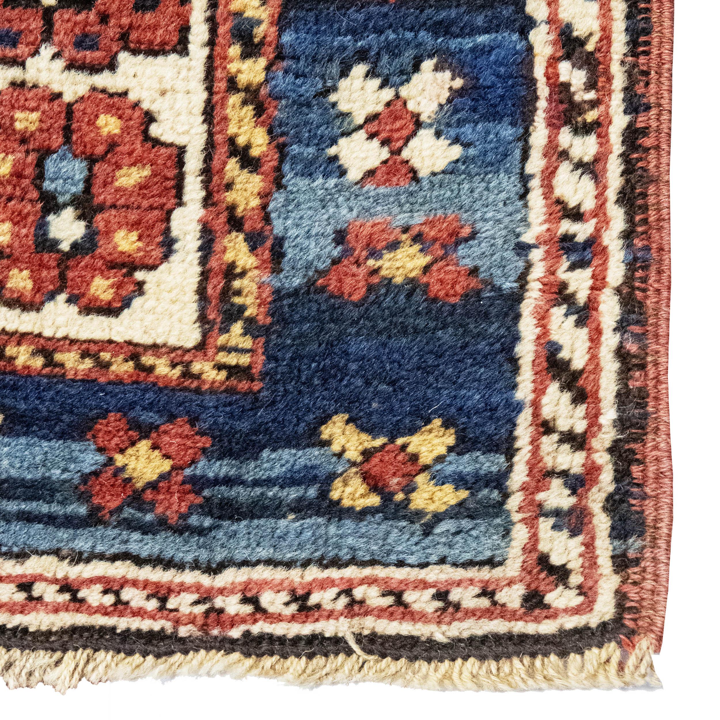 An Antique Persian fine Kazak runner is a slender and captivating textile originating from the Kazak region in the Caucasus. Handwoven with premium wool and natural dyes, its bold geometric designs and tribal motifs, like 