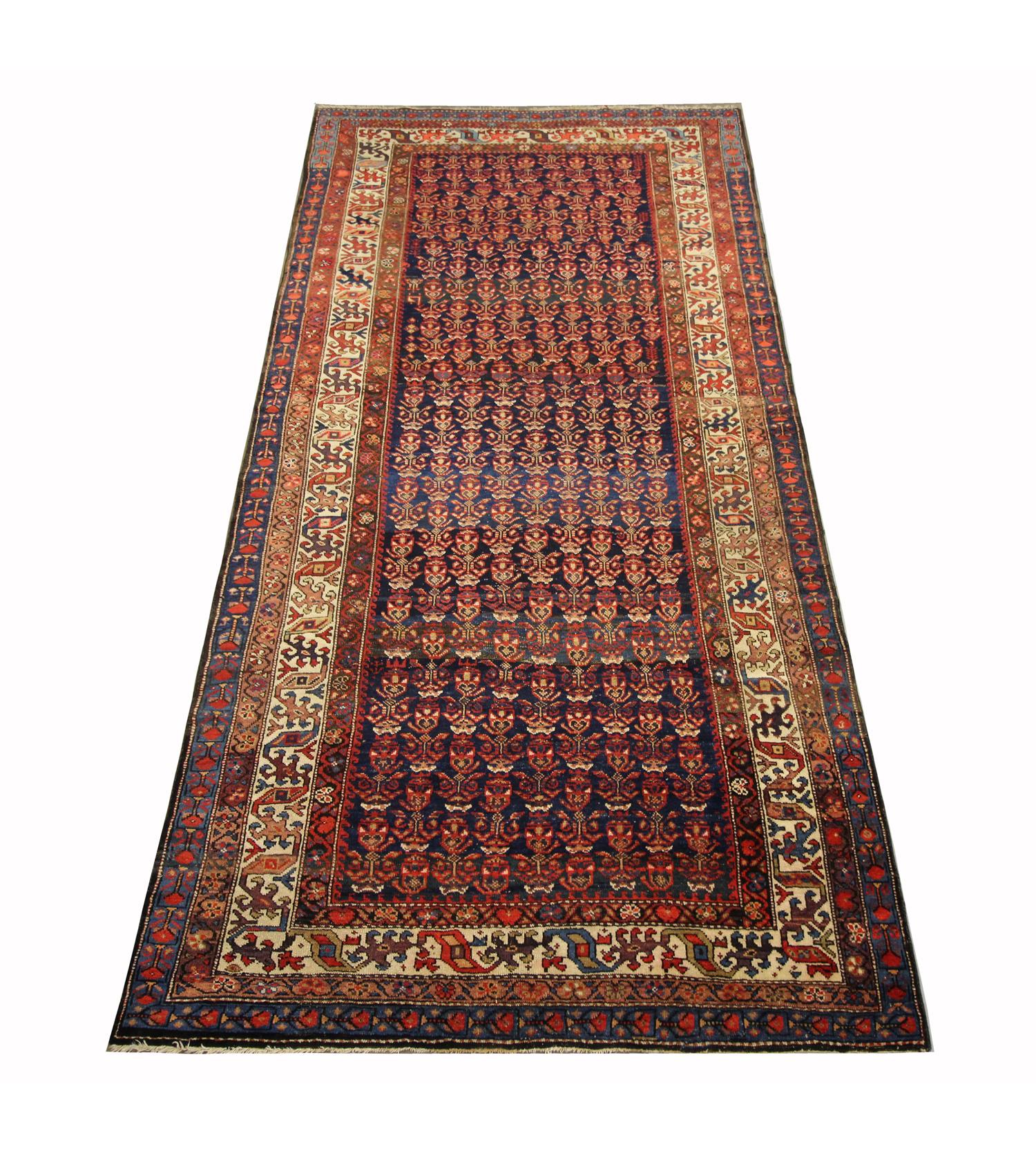 This fine wool area rug was handwoven in Azerbaijan in 1880. The central design features a bold, intricate design woven with a repeating all over pattern through the centre and a traditional layered repeating pattern design border. Both the colour