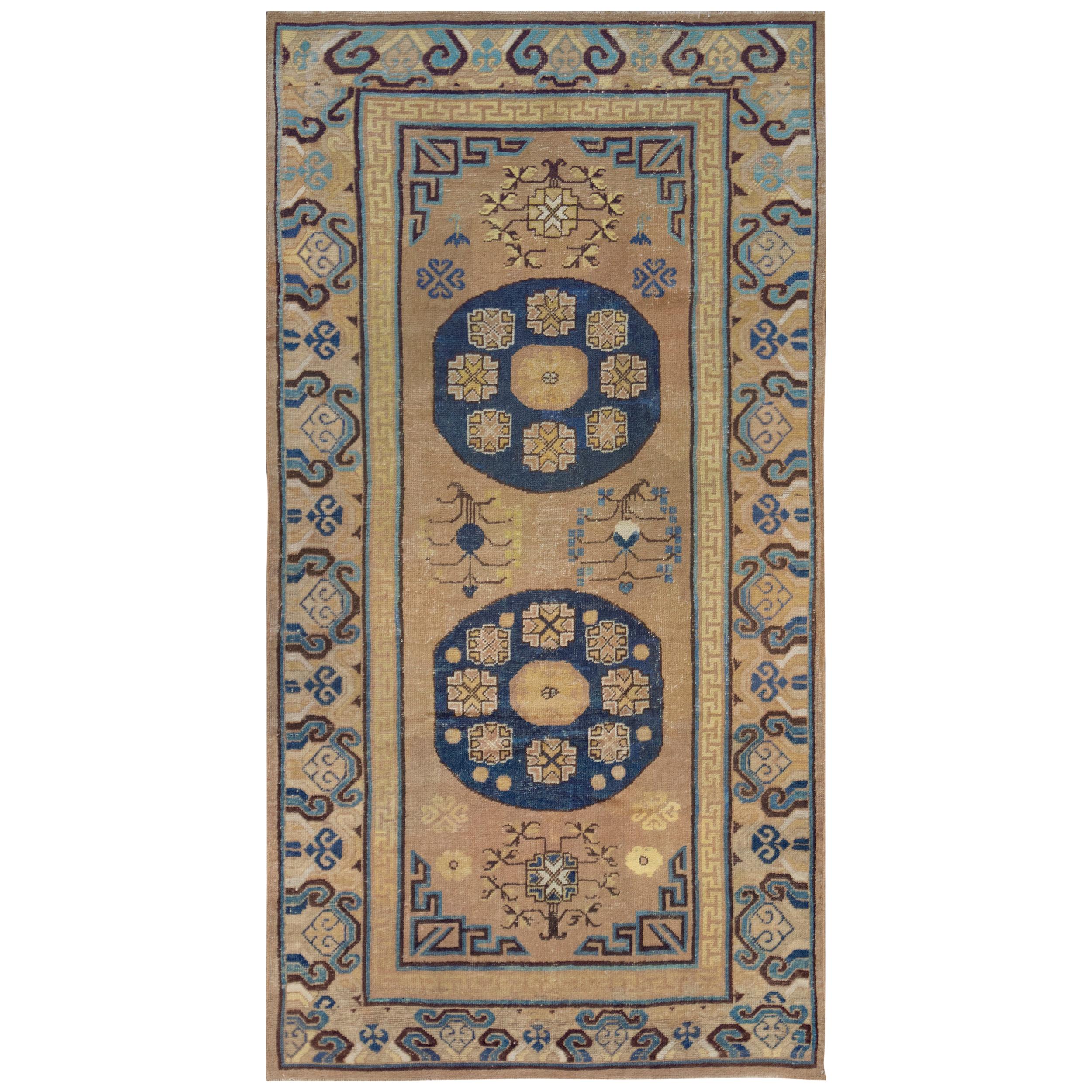 Antique Handwoven Wool Persian Khotan Runner For Sale