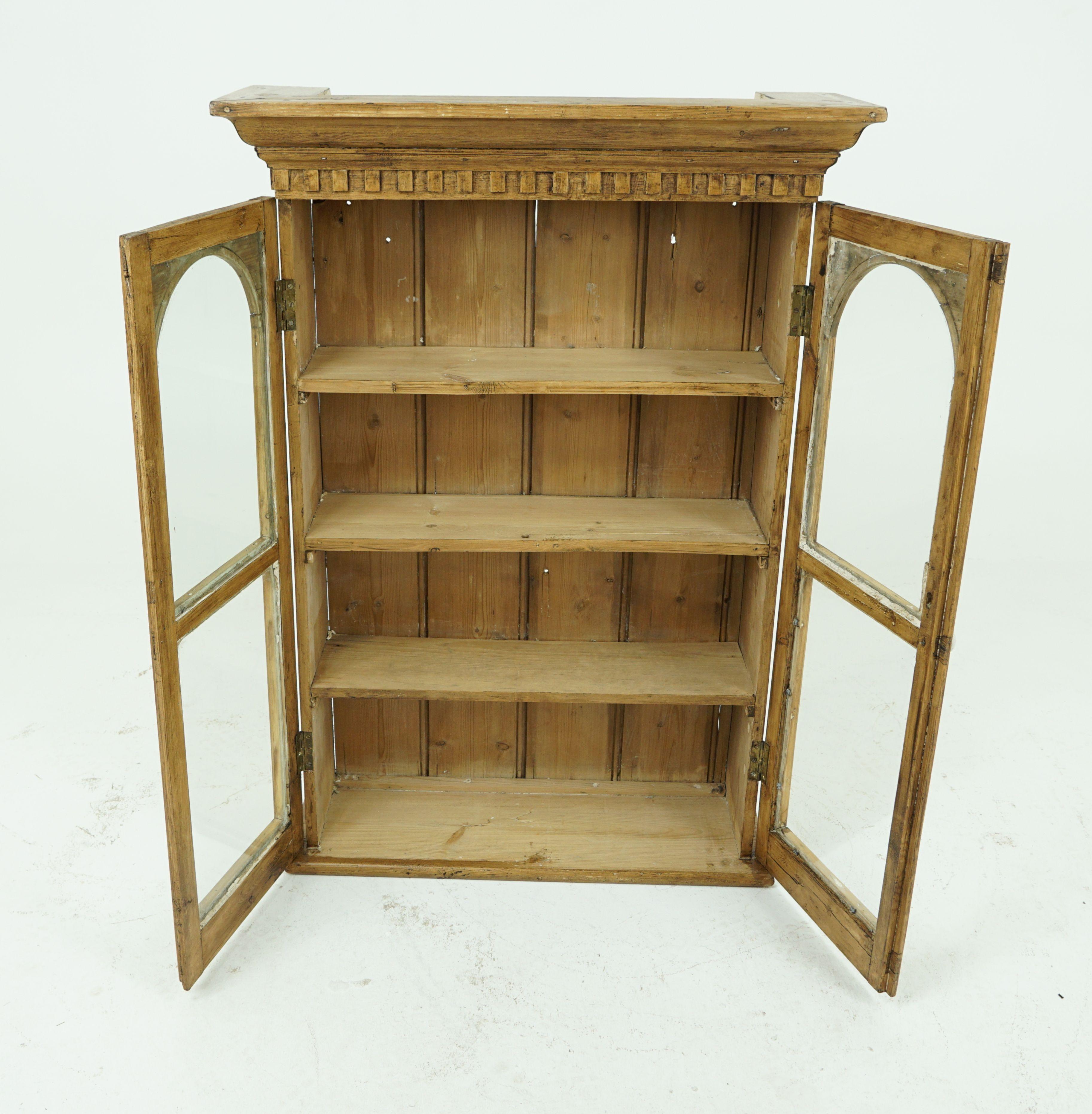 Antique hanging cabinet, Victorian pine 2-door glass fronted cabinet, antique furniture, Scotland 1880, B1786

Scotland 1880
Solid pine construction
Recently been stripped and waxed
Overhang cornice above
Dentil frieze below
Pair of domed top