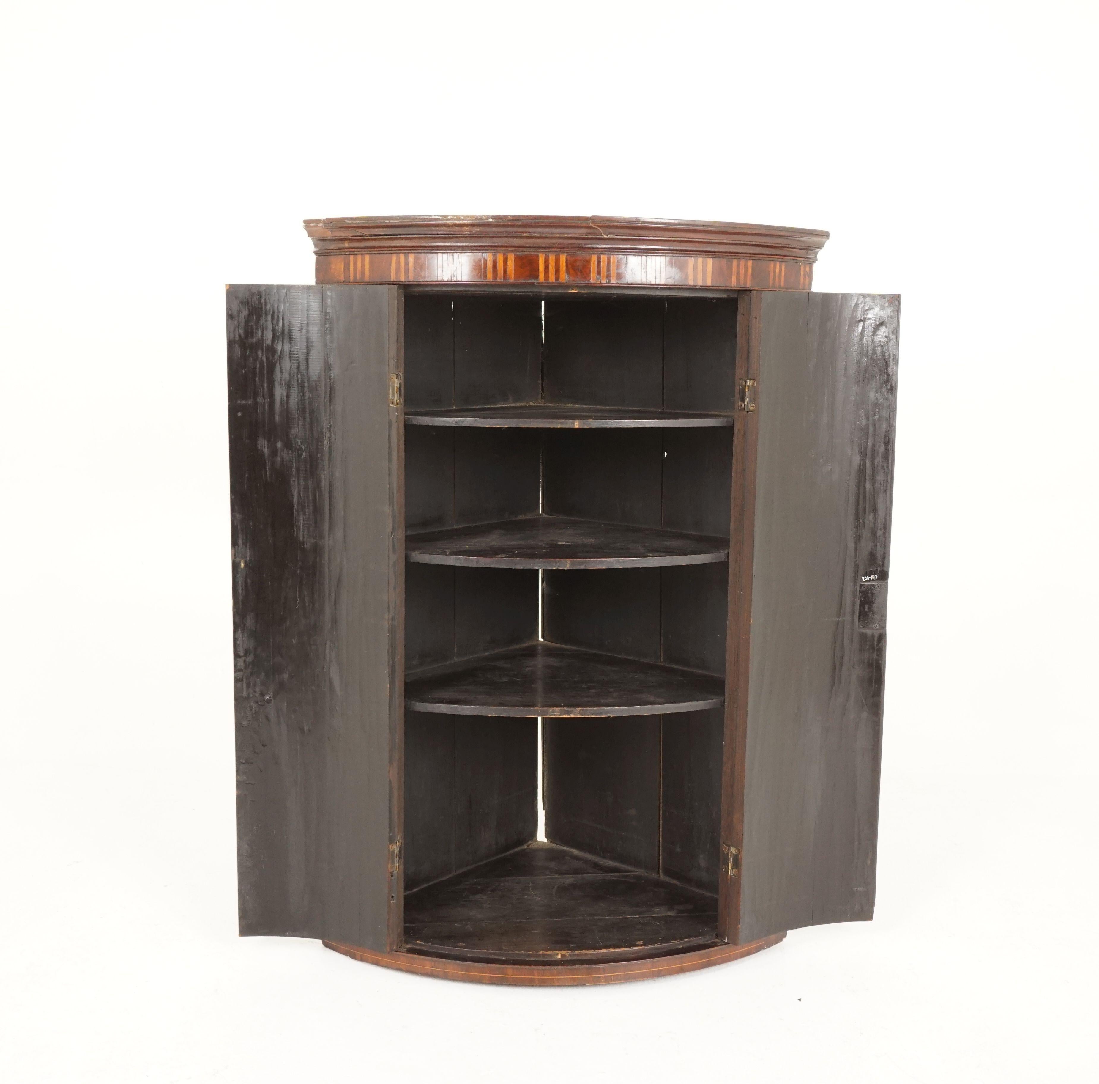 Antique hanging corner cabinet, inlaid Walnut, bow front, Scotland 1810, H138

Scotland, 1810
Solid Walnut and veneer
Original finish
Moulded cornice with an inlaid frieze
With fans and chevron border to the front and sides
Three internal