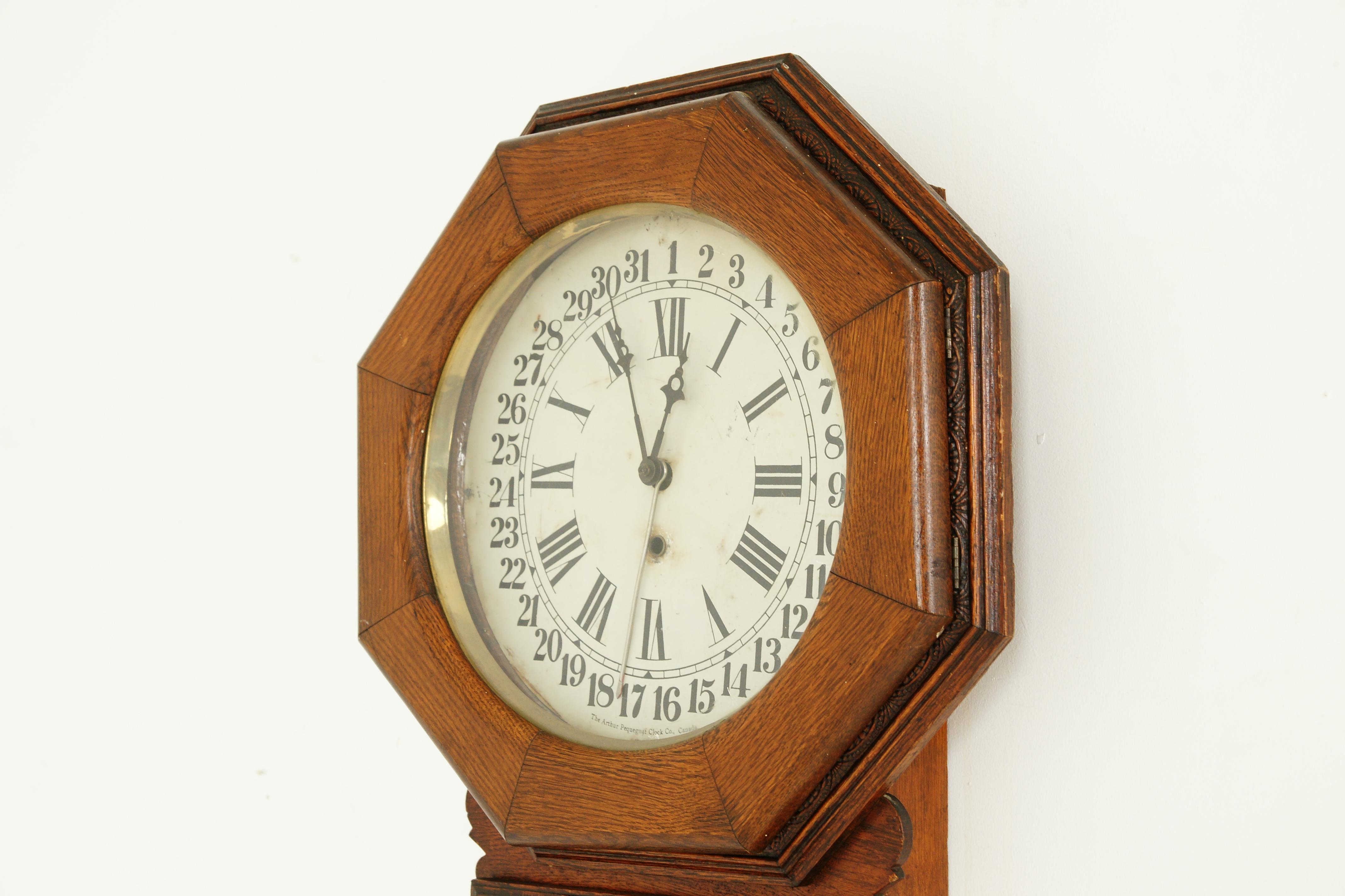 Canadian Antique Hanging Wall Clock, Eight Day, Carved Oak, Arthur Pequegnat, Canada 1910 For Sale