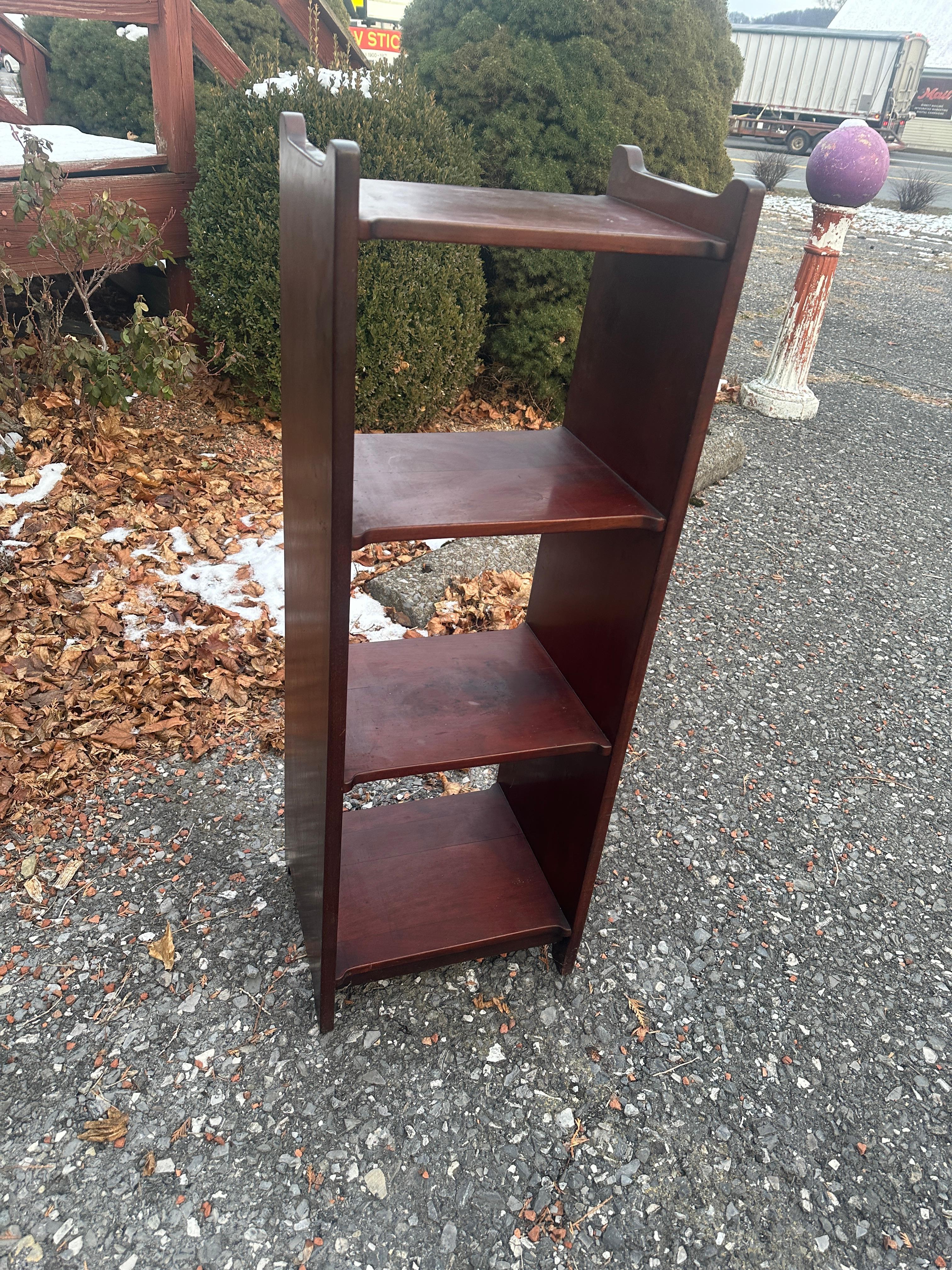 This is an antique Harden Arts & Crafts Book/Magazine Stand made in the early 1900s.  It is made from mahogany and has the original finish. The model number is written on the bottom of the stand. It is in excellent  condition with no repaired or