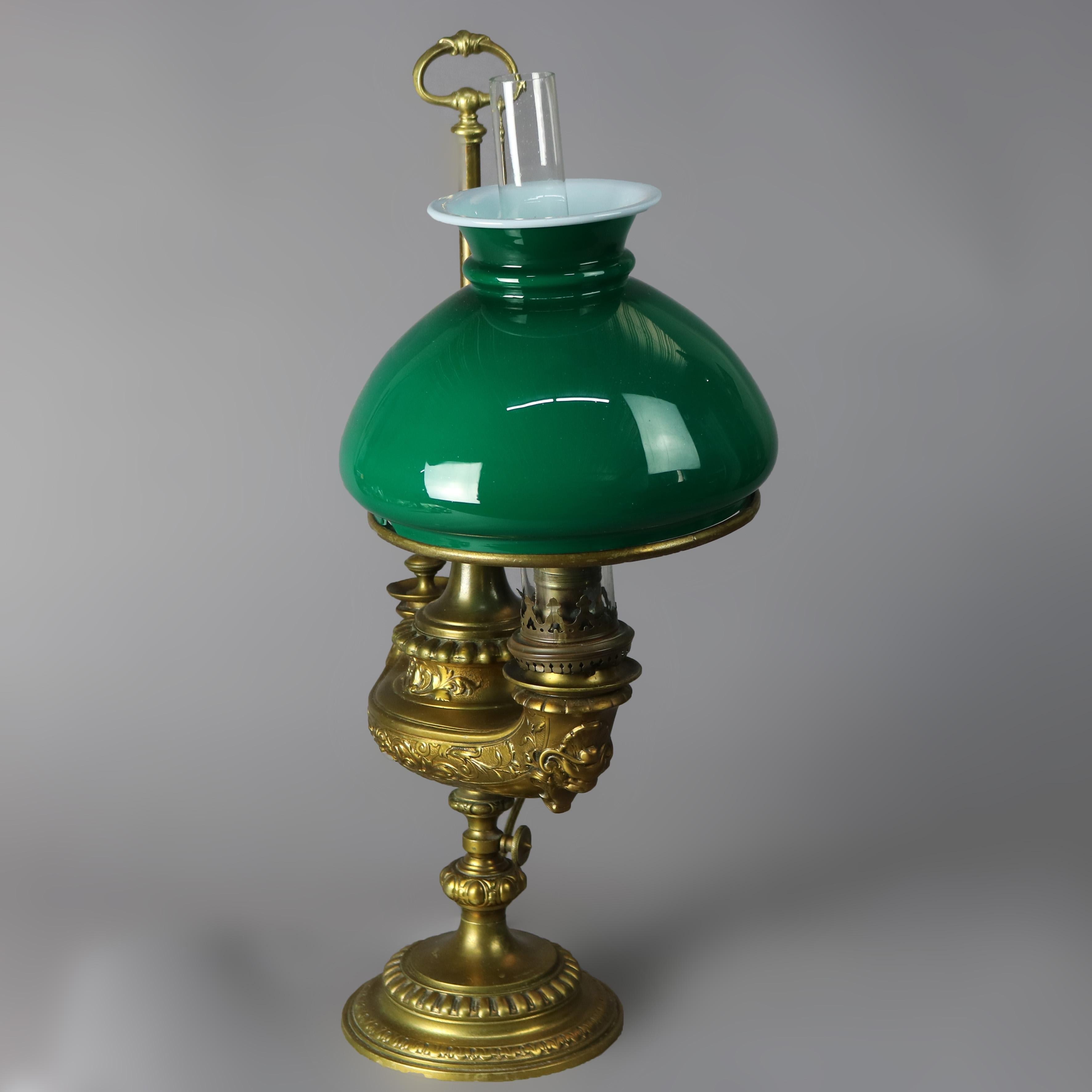 An antique Harvard student lamp offers brass construction with Aladin lamp form and Emeralite shade, electrified, 19th century

Measures - 22.5