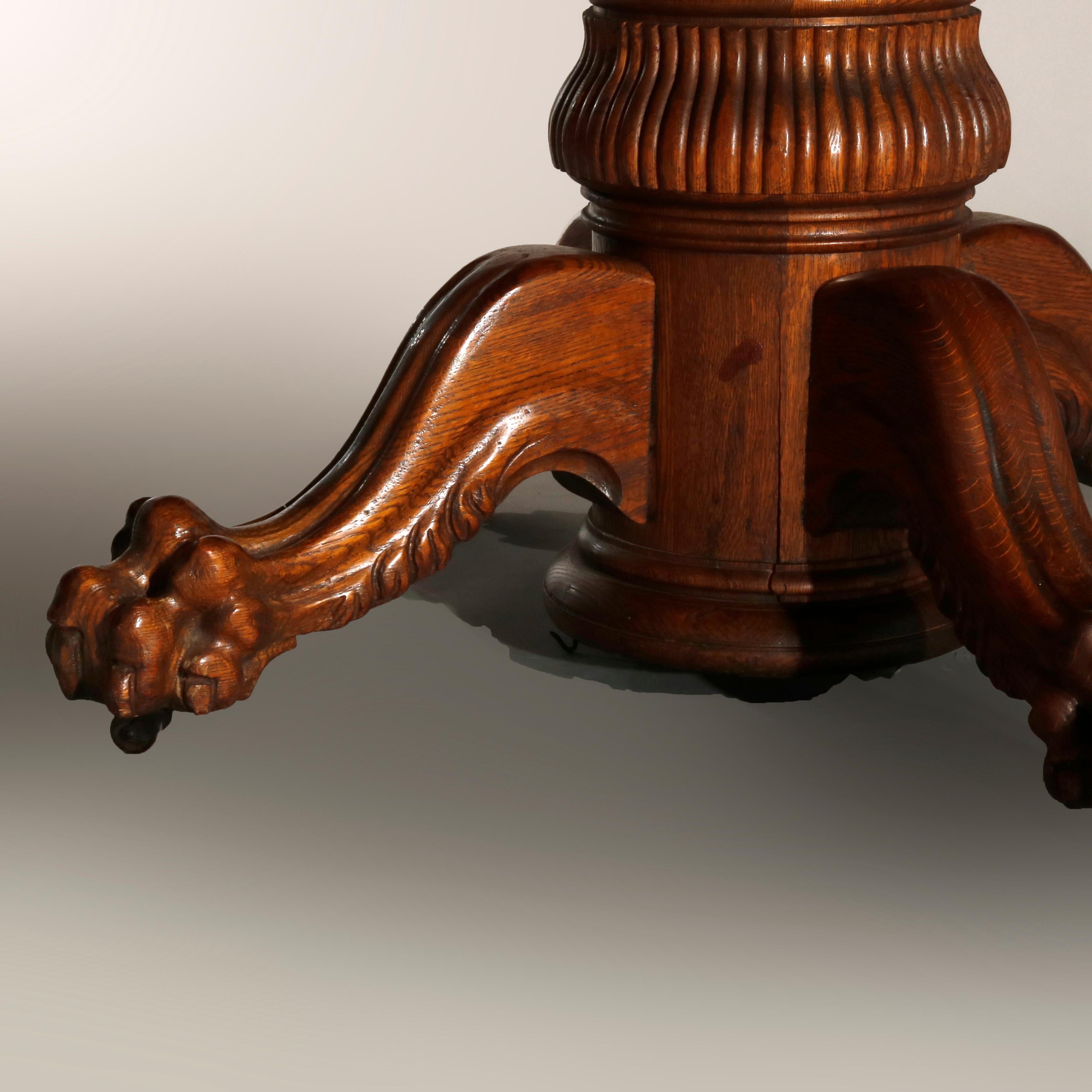 20th Century Antique Hastings Carved Oak Claw Foot Split Pedestal Dining Table, circa 1910