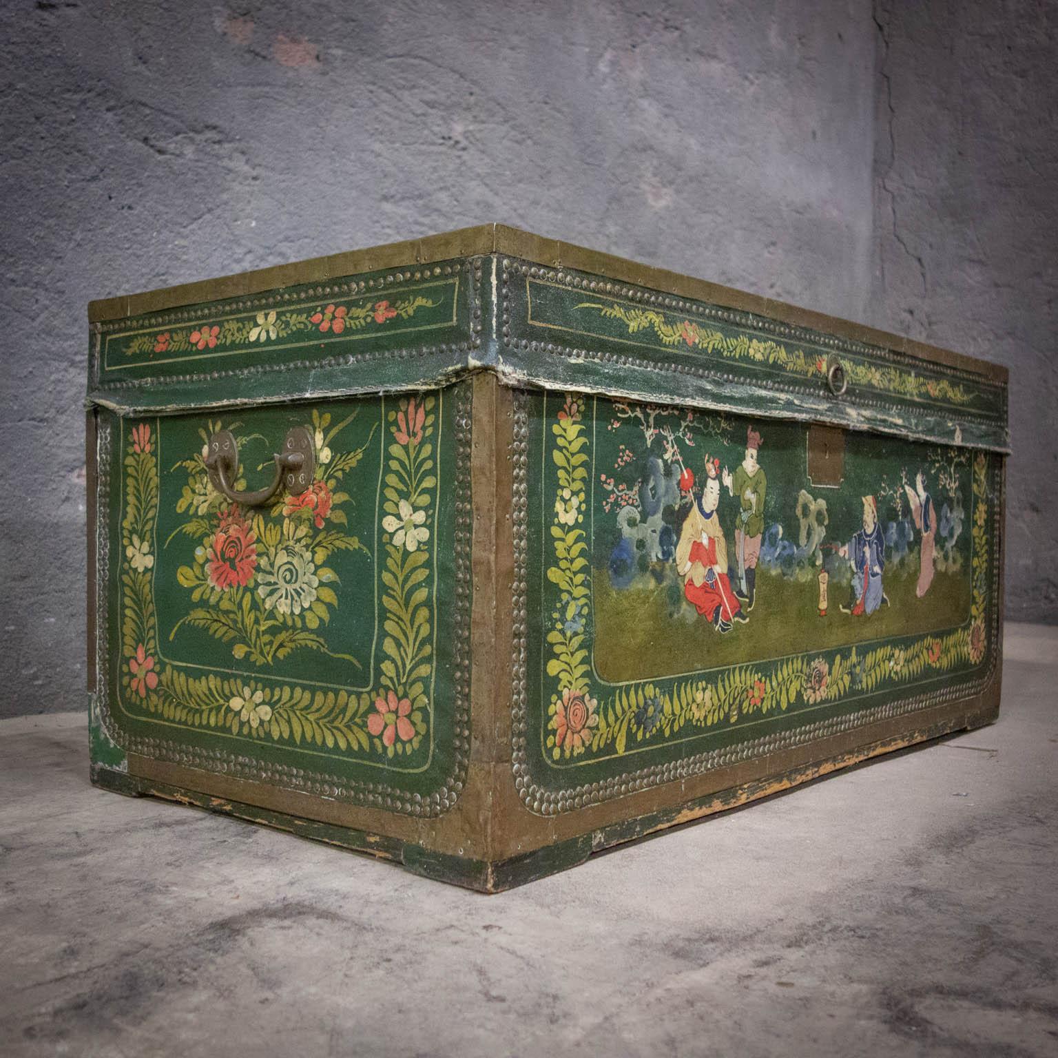 A beautiful camp chest covered with painted leather. The hand painted scenes on the coffin give a beautiful picture of Chinese antiquity. The box has a brass protective edge and handles on the outside. On the inside the box is labeled by the makers.