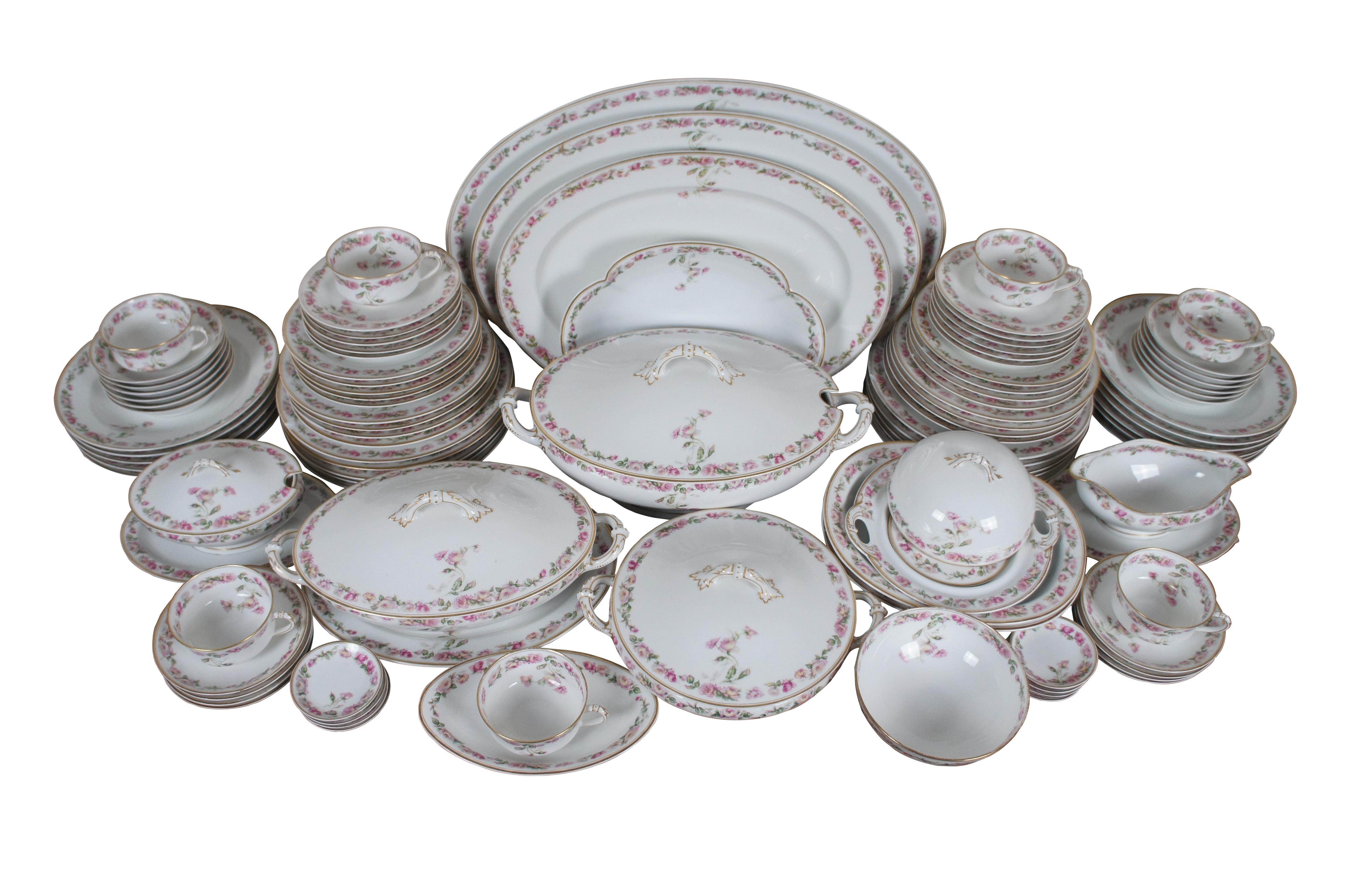 A large and impressive antique 106 piece set of Limoges porcelain dinnerware produced by Haviland & Company in The Amstel pattern (aka Schleiger, number 497A), for the Jones, McDuffie and Stratton Company. Pattern features double lined gilt edges