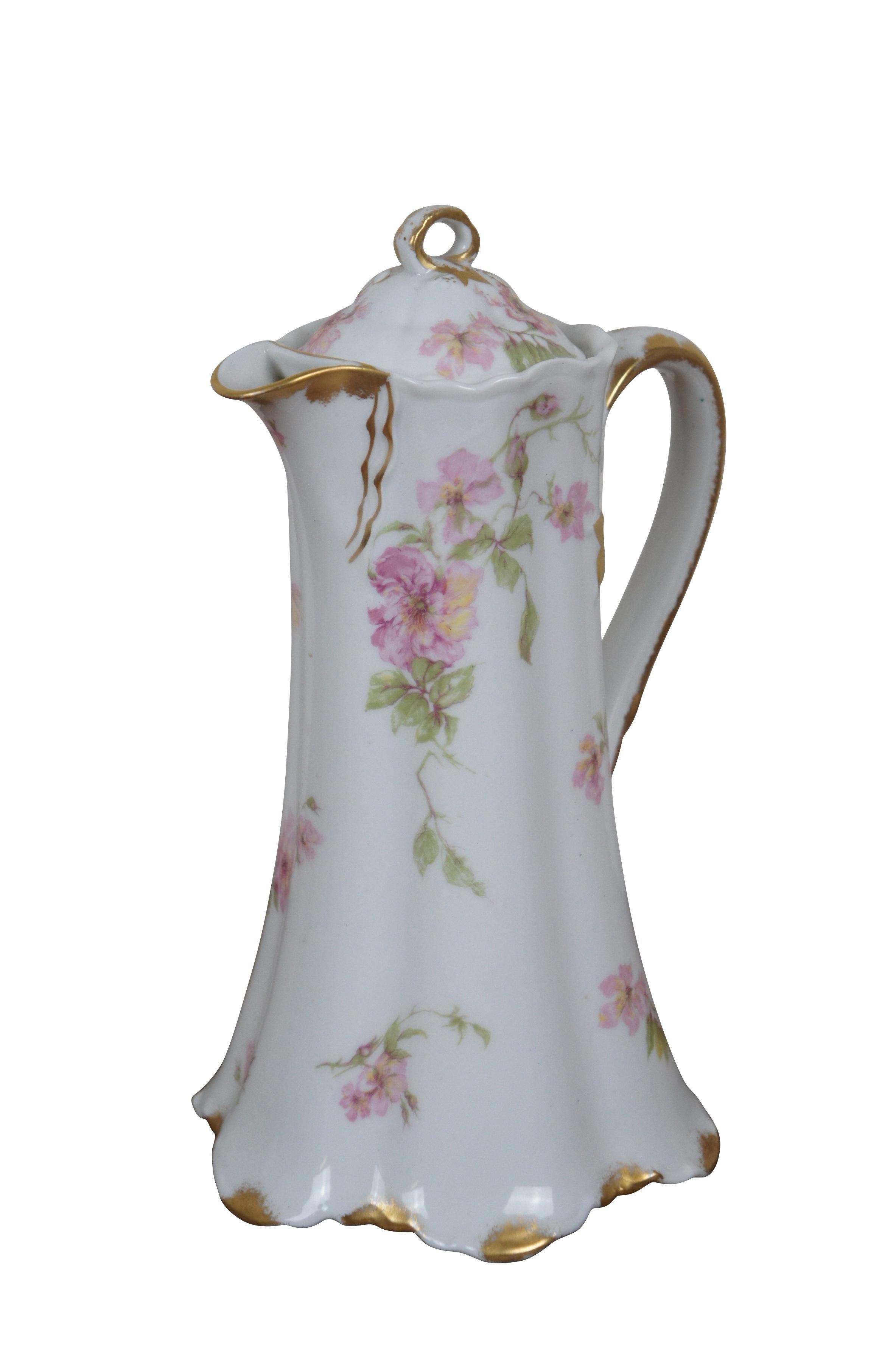 Early 20th century large Haviland & Co Limoges porcelain chocolate / tea pot. Tall with scalloped base and upper edge, ribbon shaped handle, hand painted with springs of pink roses and gilded details.

