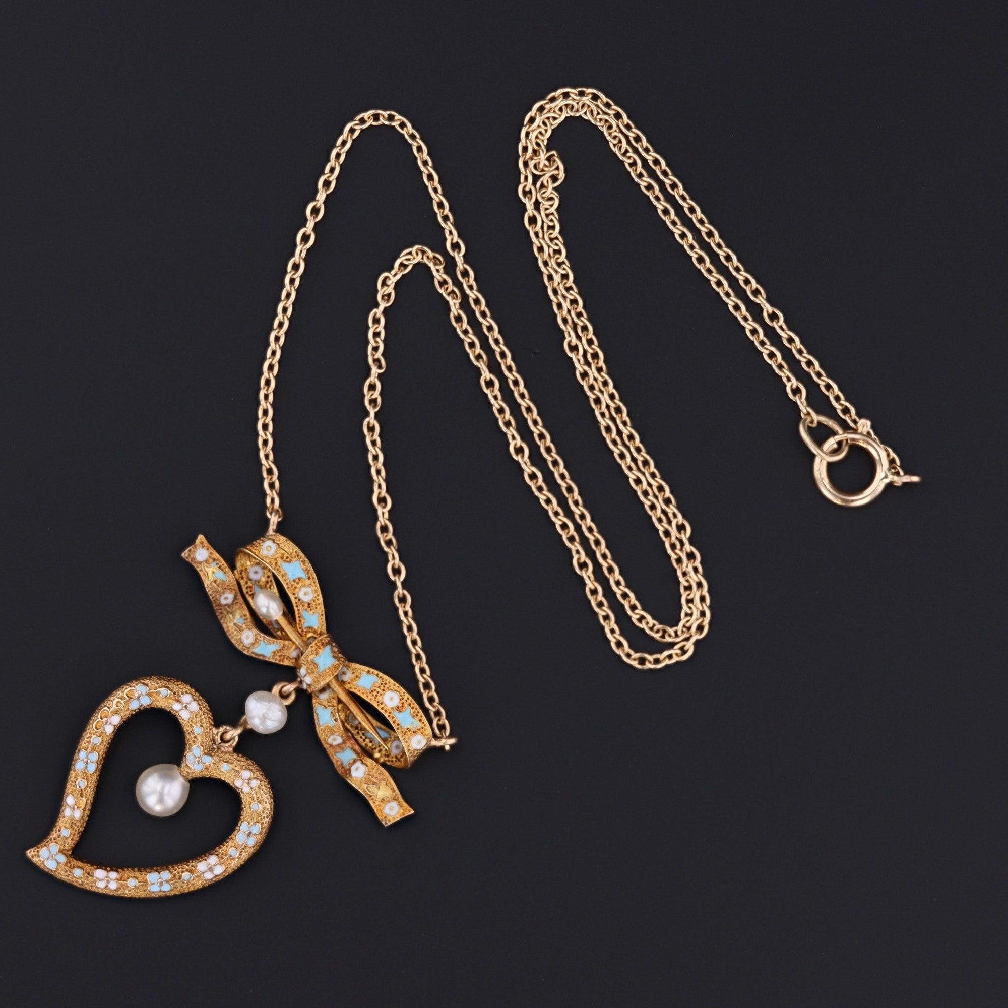 Antique Enamel Heart & Bow Necklace in 14k Gold (Converted, Early 1900s)

Infused with sentiment and early 20th-century charm, this exquisite necklace was artfully created by repurposing two antique 14k gold pins from the early 1900s—a bow and