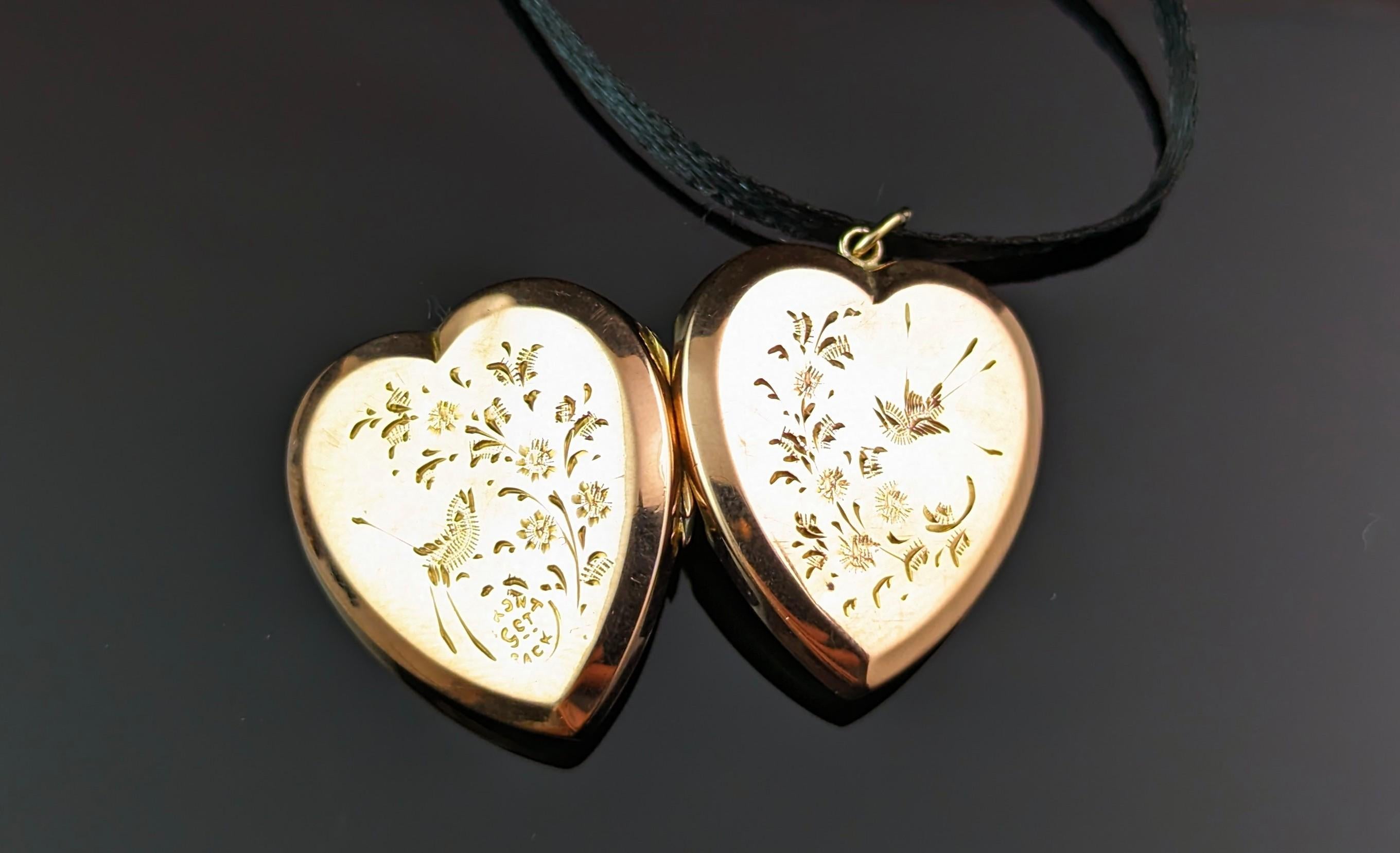 A sweet little antique 9ct gold front and back, heart shaped locket pendant.

Edwardian era it has elaborately engraved designs to the front and back featuring birds and foliage in an aesthetic manner.

Internally it has two compartments but no