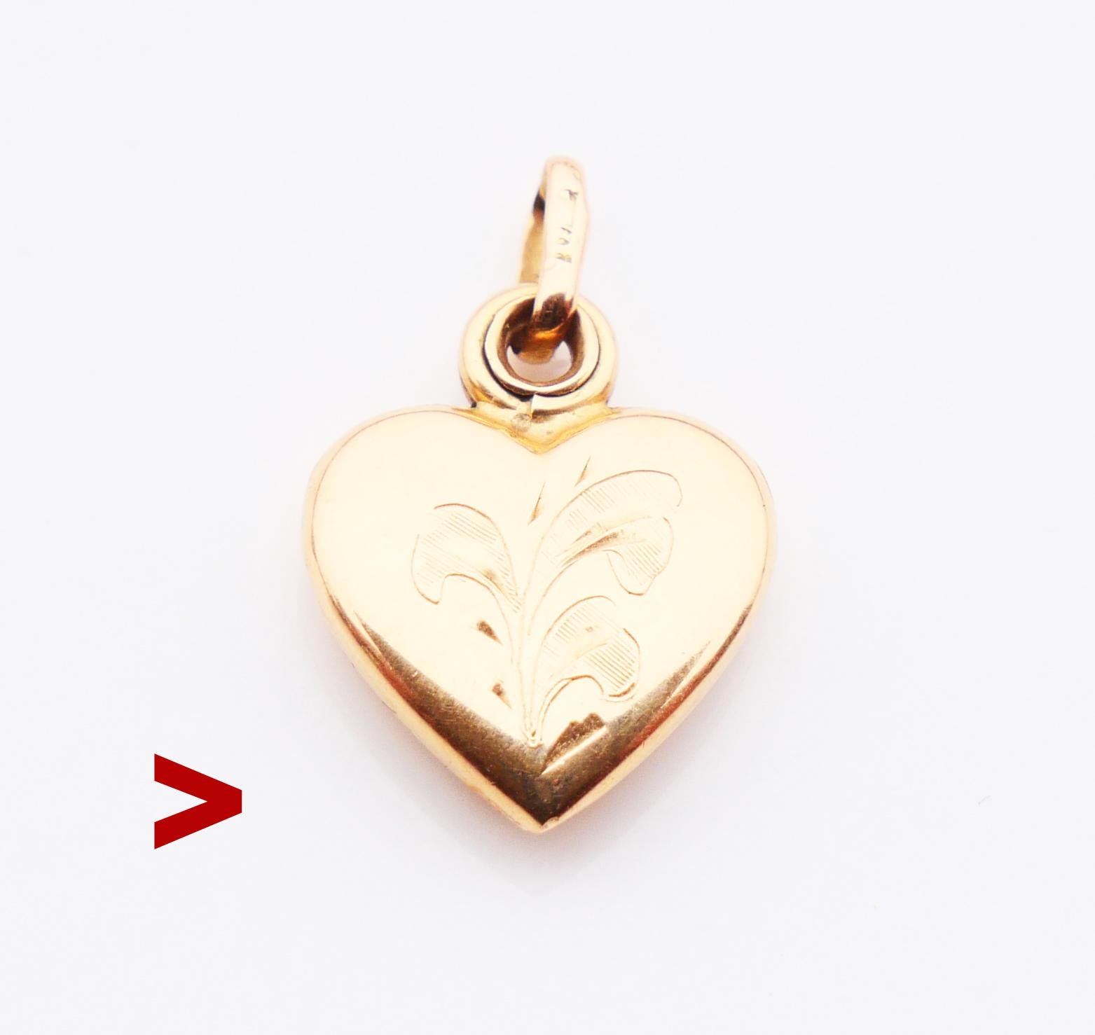 
Old ❤ shaped Pendant / Locket made in Germany, ca. 1920s - 1930s in solid 18K Yellow Gold with floral hand - engraving on the frontal side. Two sliding sideways sections with removable bezels for your photographs. The halves open, move and close