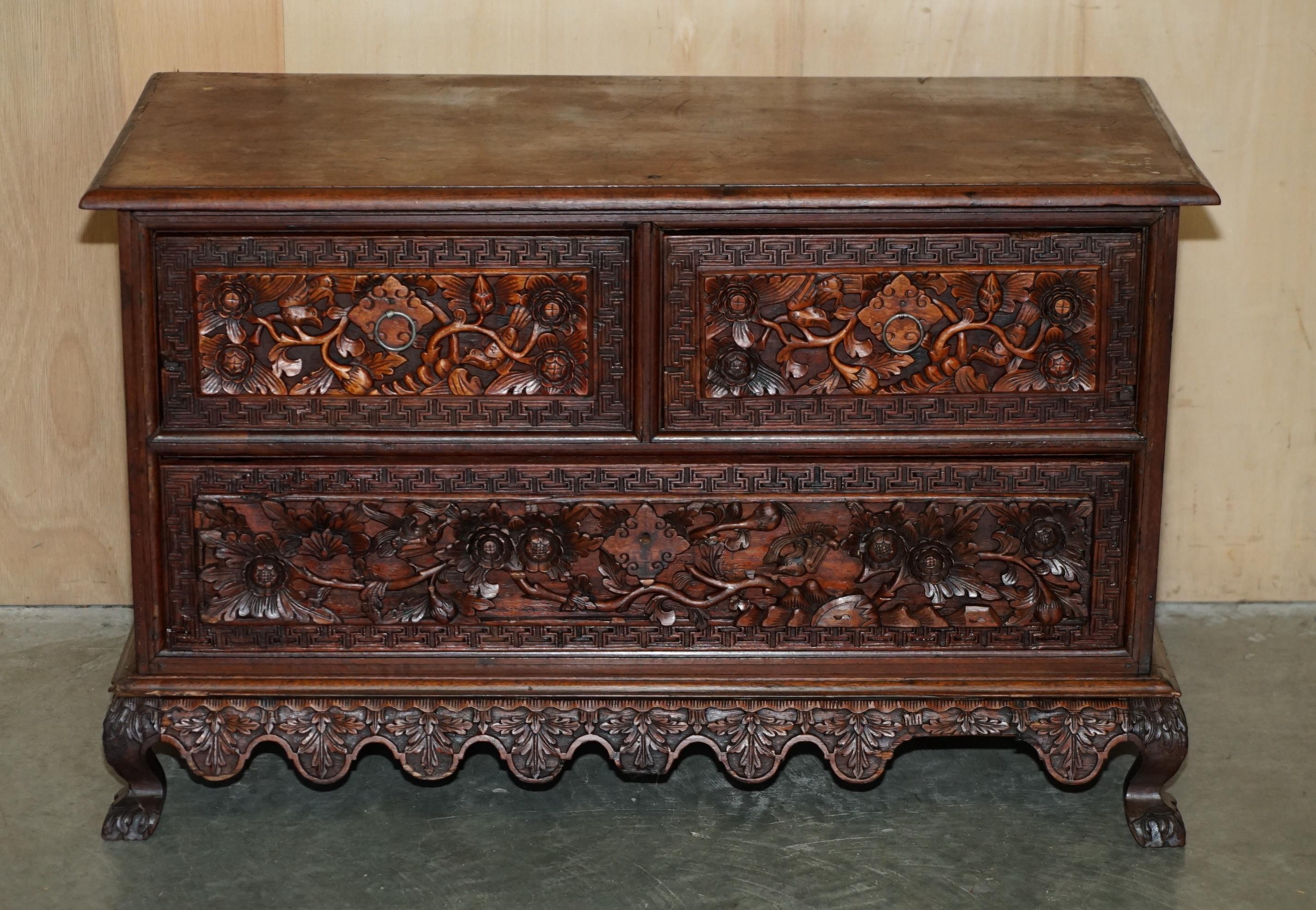 Royal House Antiques

Royal House Antiques is delighted to offer for sale this heavily carved Indonesian export circa 1940-1950 small two over one chest of drawers ideally suited as a tv stand or side table 

Please note the delivery fee listed is