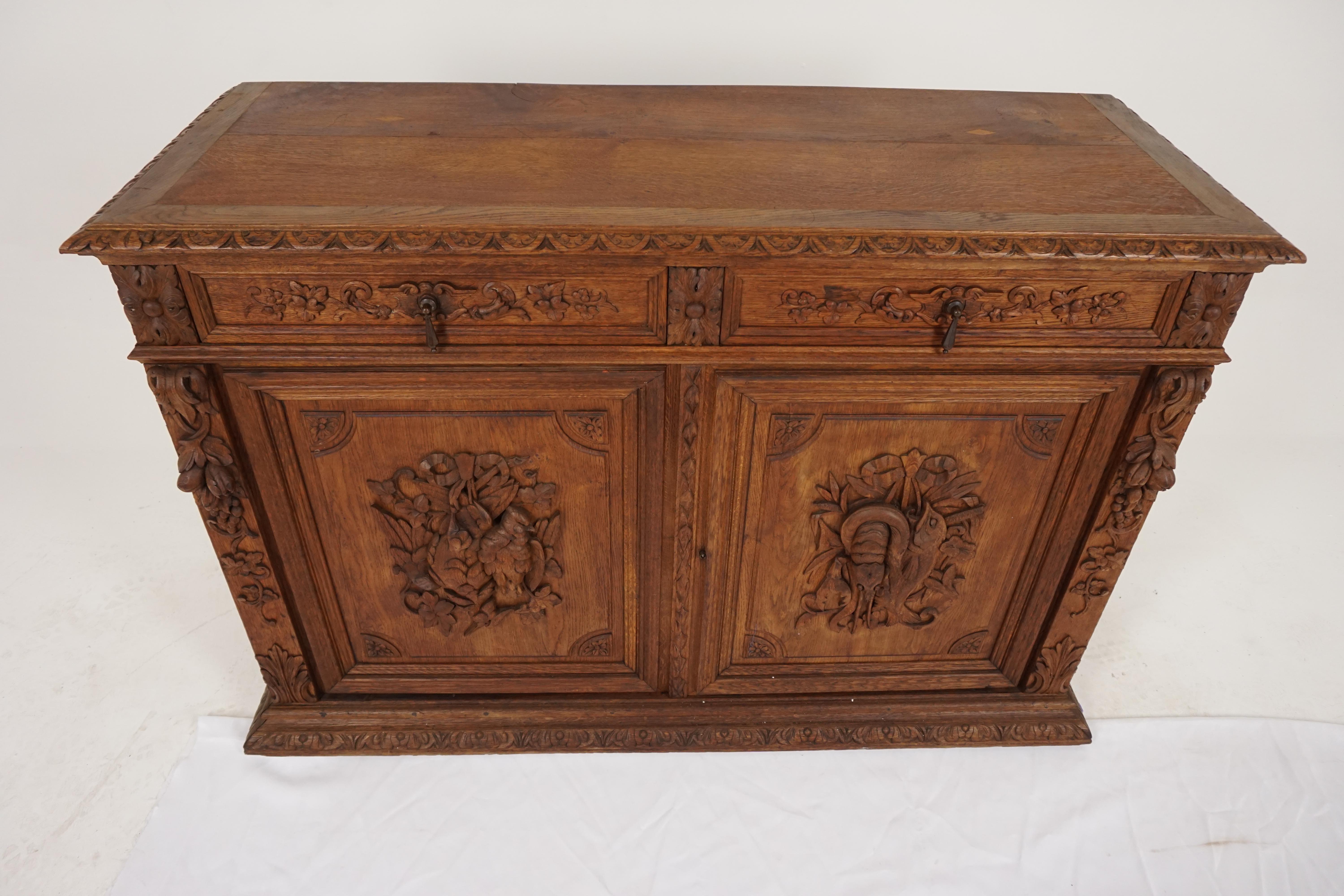 Antique heavily carved oak sideboard buffet, Scotland, 1880, B1819

Scotland 1880
Solid oak
Original finish
Rectangular oak top with carved mold edging
Pair of dove tailed carved drawers
Pair of carved paneled doors; crayfish on one side,