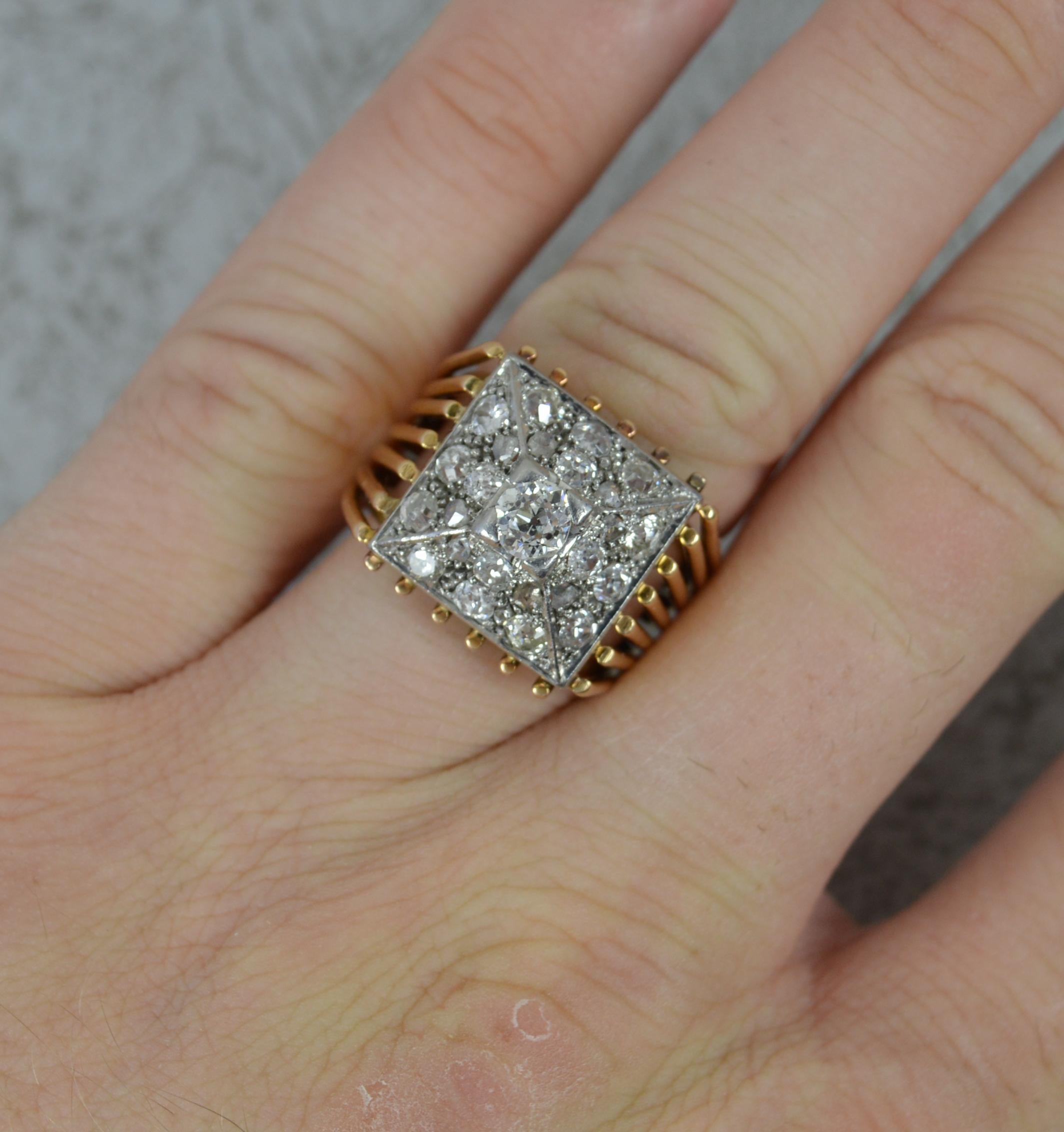A superb antique diamond cluster ring, circa 1910/20.
Solid and heavy 18 carat gold example with a platinum head setting.
Designed with a natural old cut diamond to centre and an additional 24 smaller old cut diamonds surrounding in a square shaped