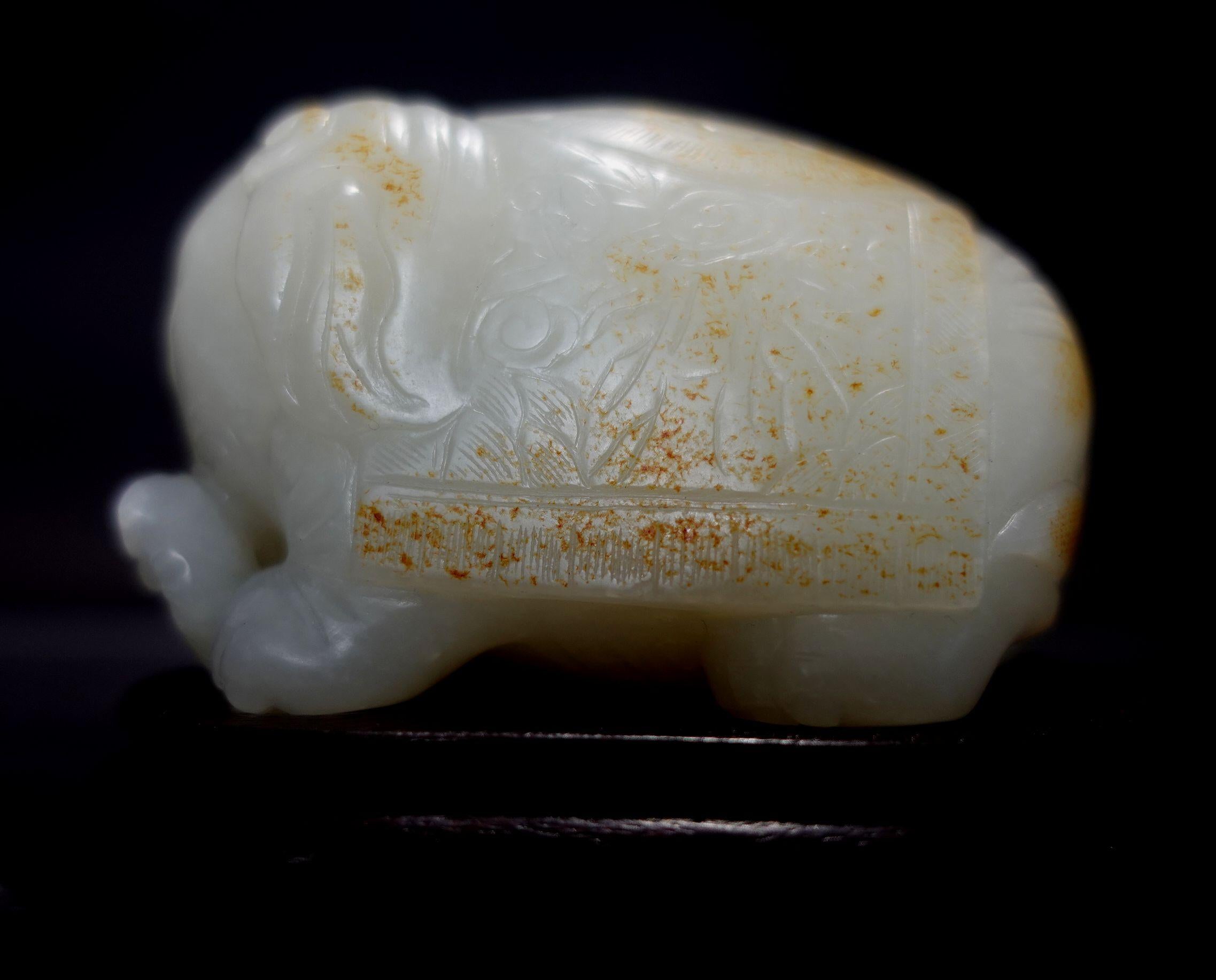 A lovely and cute hand-carved antique, Heavy and Faty Chinese Carved  Hetain White Jade with russet markings, very pure and clean in the body contents with the mutton fat appearance, holding on the hand with a heavy weight feeling. This elephant was