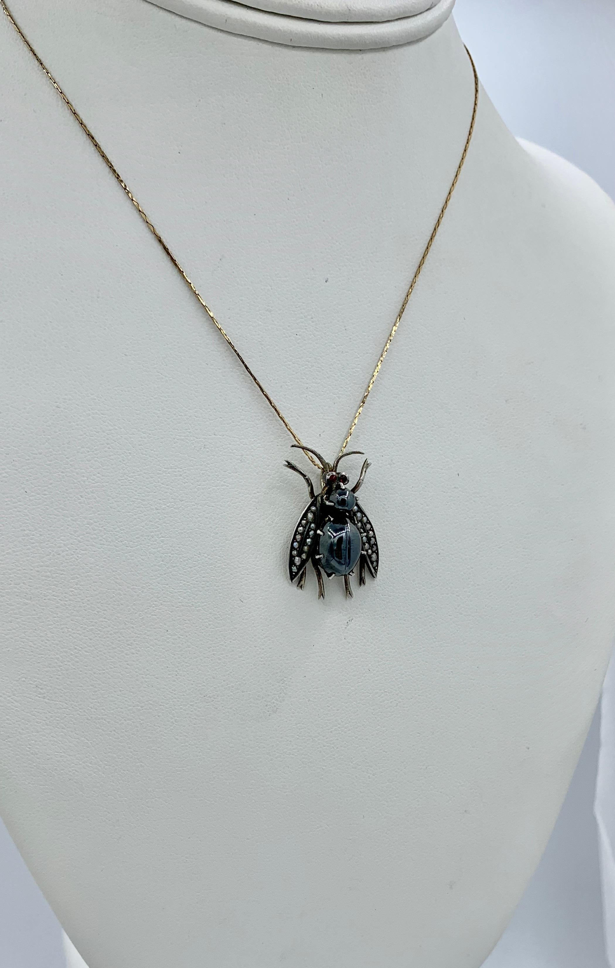 This is an absolutely wonderful and rare antique Victorian Fly, Beetle, Insect Pendant Necklace.  The stunning three dimensional insect is set with a round and an oval Hematite gem cabochon to form the body.  The larger hematite is carved with a