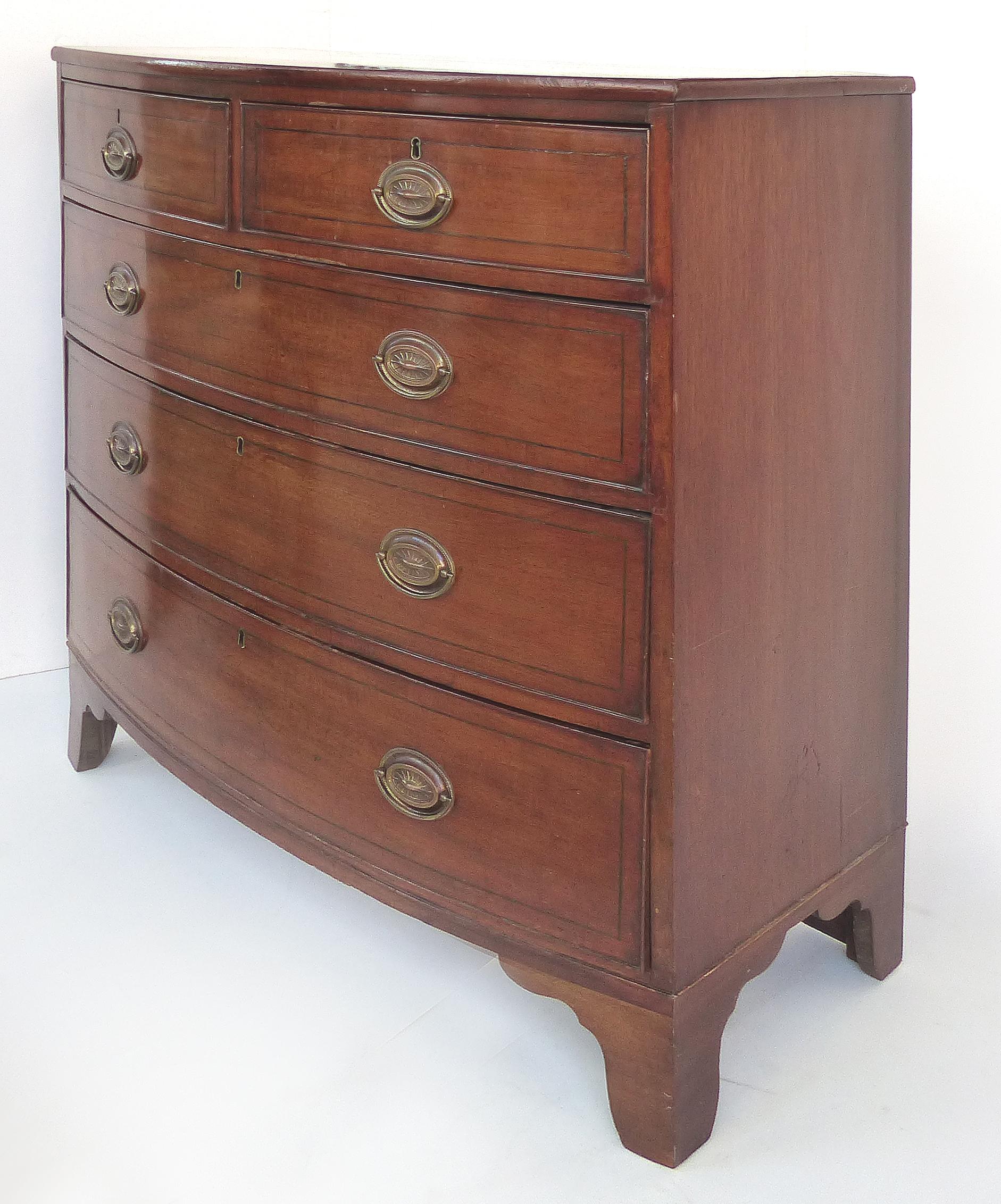 Antique Hepplewhite bow-front chest of drawers in mahogany 

Offered for sale is a late 19th-early into 20th-century Hepplewhite mahogany five drawer bow-front chest of drawers. The cabinet is supported by bracket feet. The dresser retains the