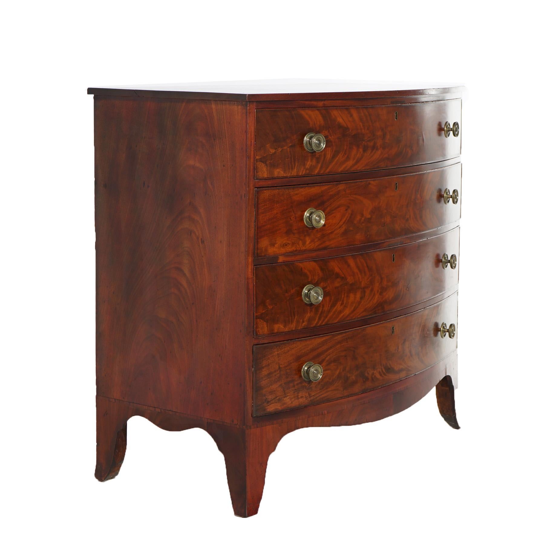 An antique Hepplewhite chest offers flame mahogany construction in bow front form with four long drawers raised on slayed feet, c1830

Measures- 39.25''H x 41''W x 23.25''D
