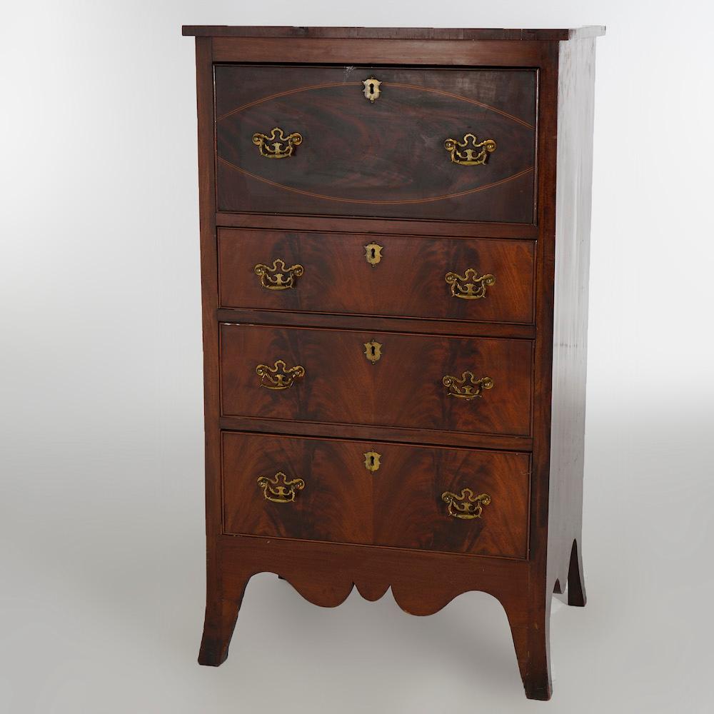An antique Hepplewhite lingerie chest of drawers offers flame mahogany construction with single deep drawer having inlaid oval decoration over three graduated drawers and raised on splayed feet, 19th century

Measures- 47.25'' H x 26.75'' W x