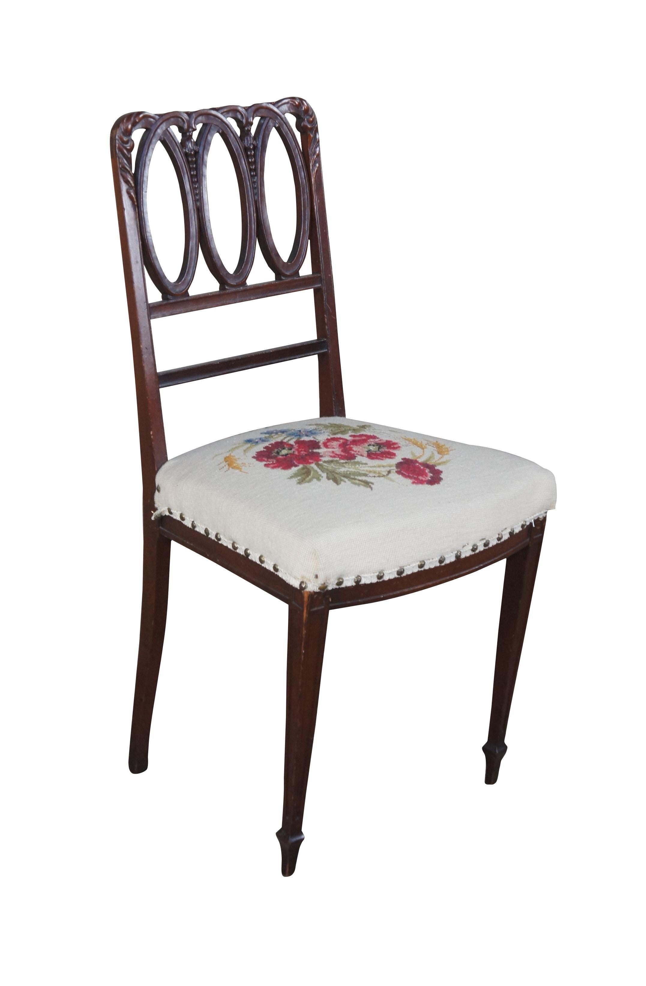 Antique Hepplewhite Hoop Back accent chair.  Made of mahogany featuring pierced reticulated design with floral rose needlepoint seat with nailhead trim over tapered front legs.

Manchester Upholstering Co, Better Grade Furniture, Jamaica New York
