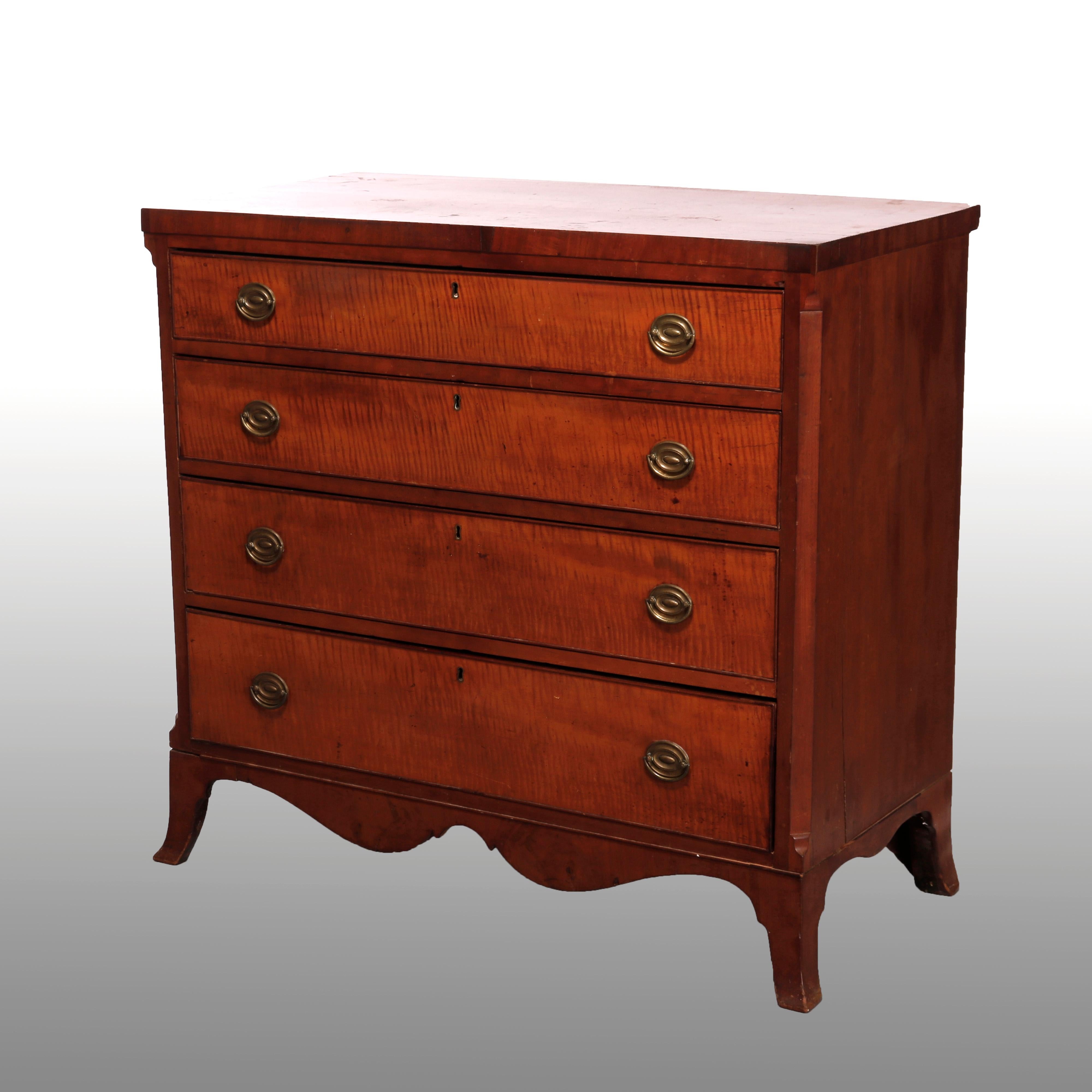 An antique Hepplewhite chest of drawers offers maple construction with case having four graduated tiger maple drawers over shaped skirt, raised on splayed feet, c1830

Measures- 38.75''H x 41.5''W x 20.5''D.

Catalogue Note: Ask about DISCOUNTED