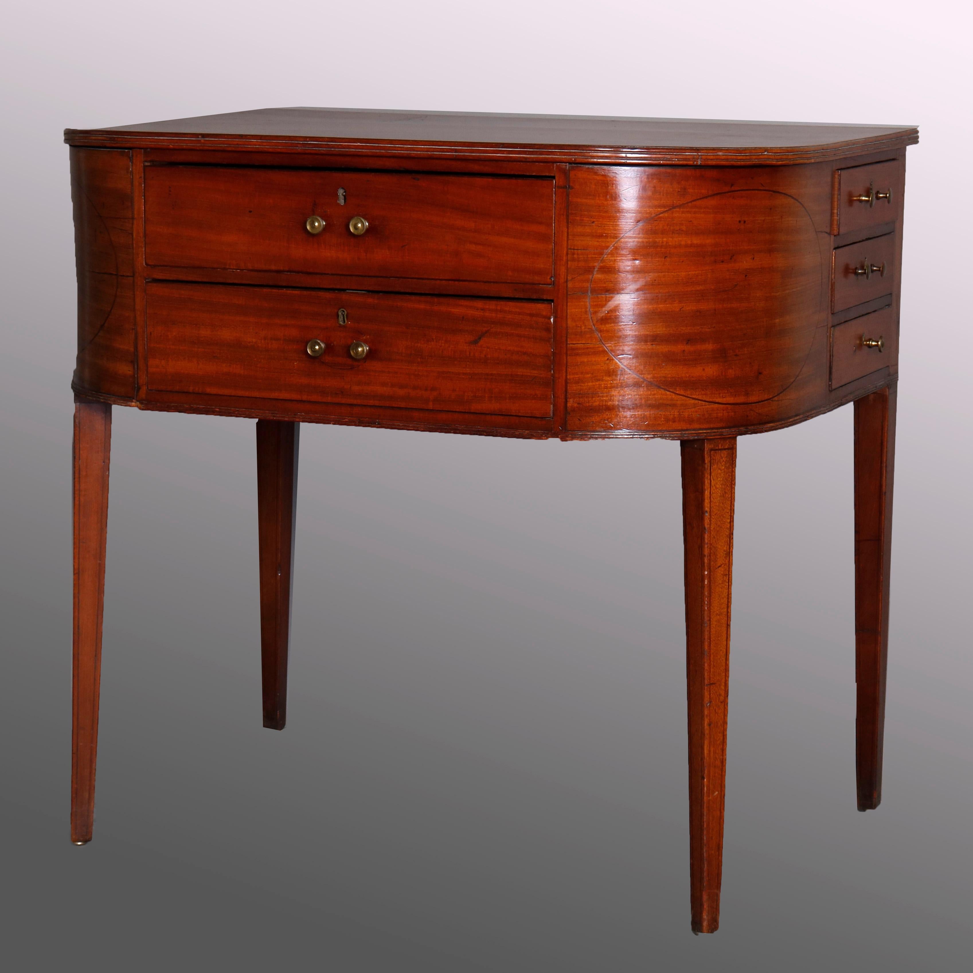 An antique Hepplewhite style rent table offers unusual form in mahogany construction with face having 2 long drawers flanked by bentwood panels with ebonized inlay medallions, sides with three smaller drawers each, raised on tapered square legs,