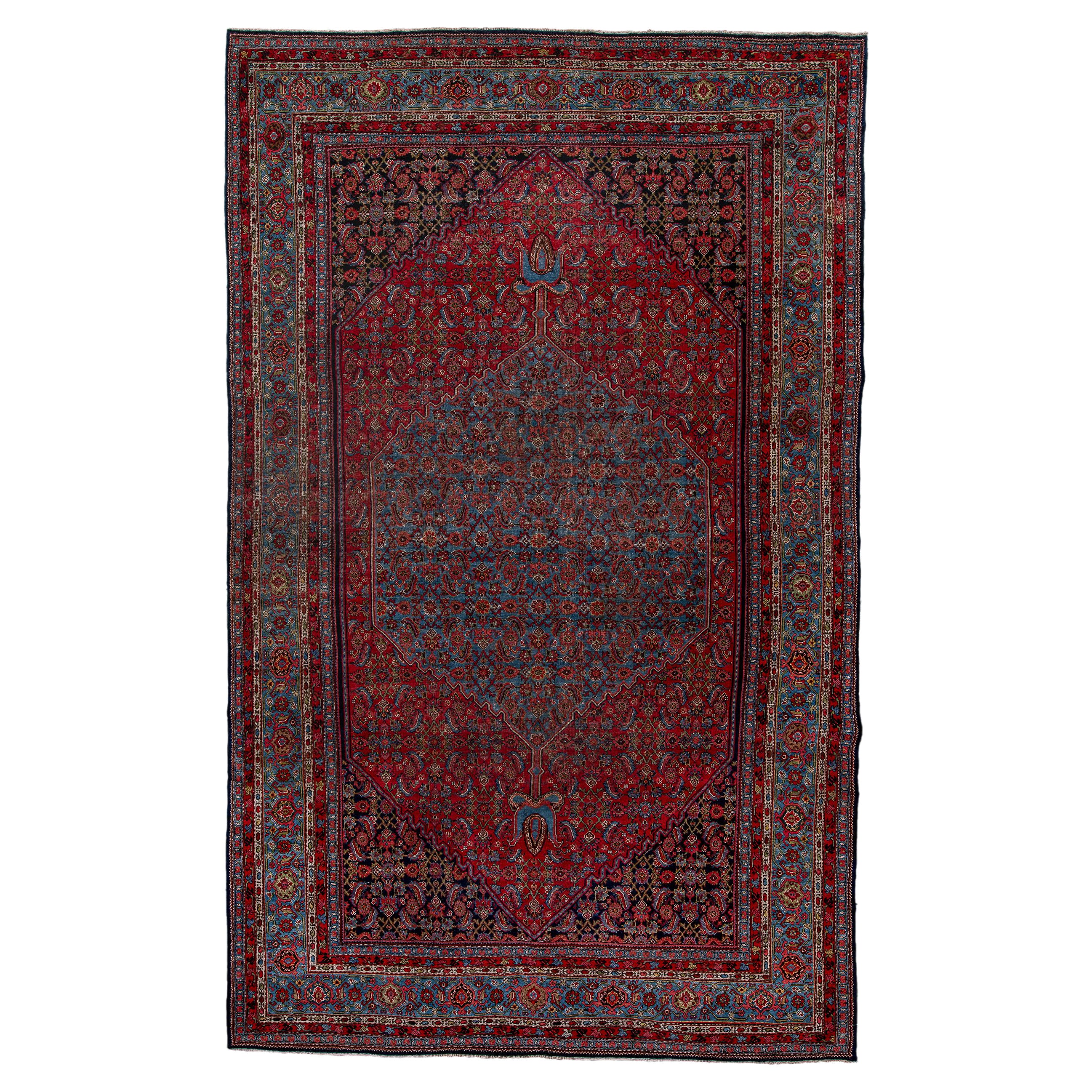 Antico disegno Herati con campo rosso e bordo blu navy