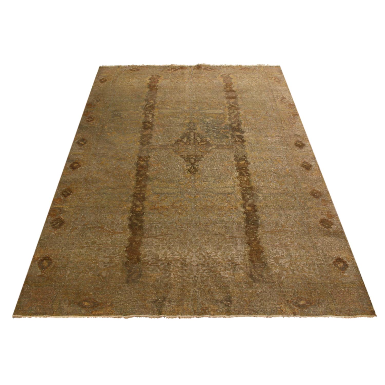 Hand knotted with metallic-thread wool originating from Turkey in 1880, this antique Hereke rug hosts a luminous, light-catching body with both versatile and lively beige-brown, golden yellow, and frost blue colorways. Enjoying minimal distress on