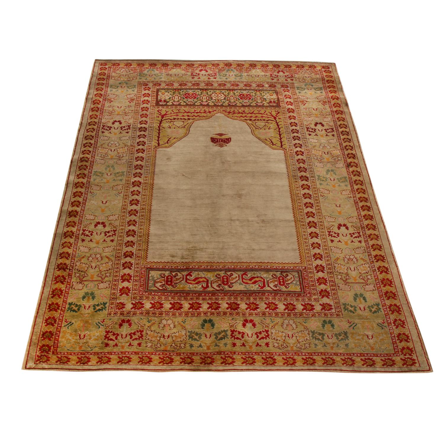 Dancing curvilinear patterns paired with a classic sense of eastern symmetry lend this antique Hereke rug tones of grandeur and whimsy alike. Originating from Turkey between 1910-1920, this piece enjoys hand-knotted high-quality silk throughout the