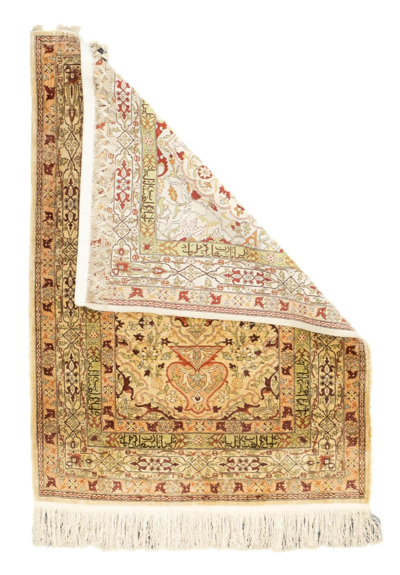 Antique Hereke Rug 2'8'' x 3'8''. Sandy ecru niche shaped field with a central basal vase and half columns with palmette capitals. Inscribed alam-shaped panel just above, and vinery writhing about. Yellow inner inscription border. Ecru main border