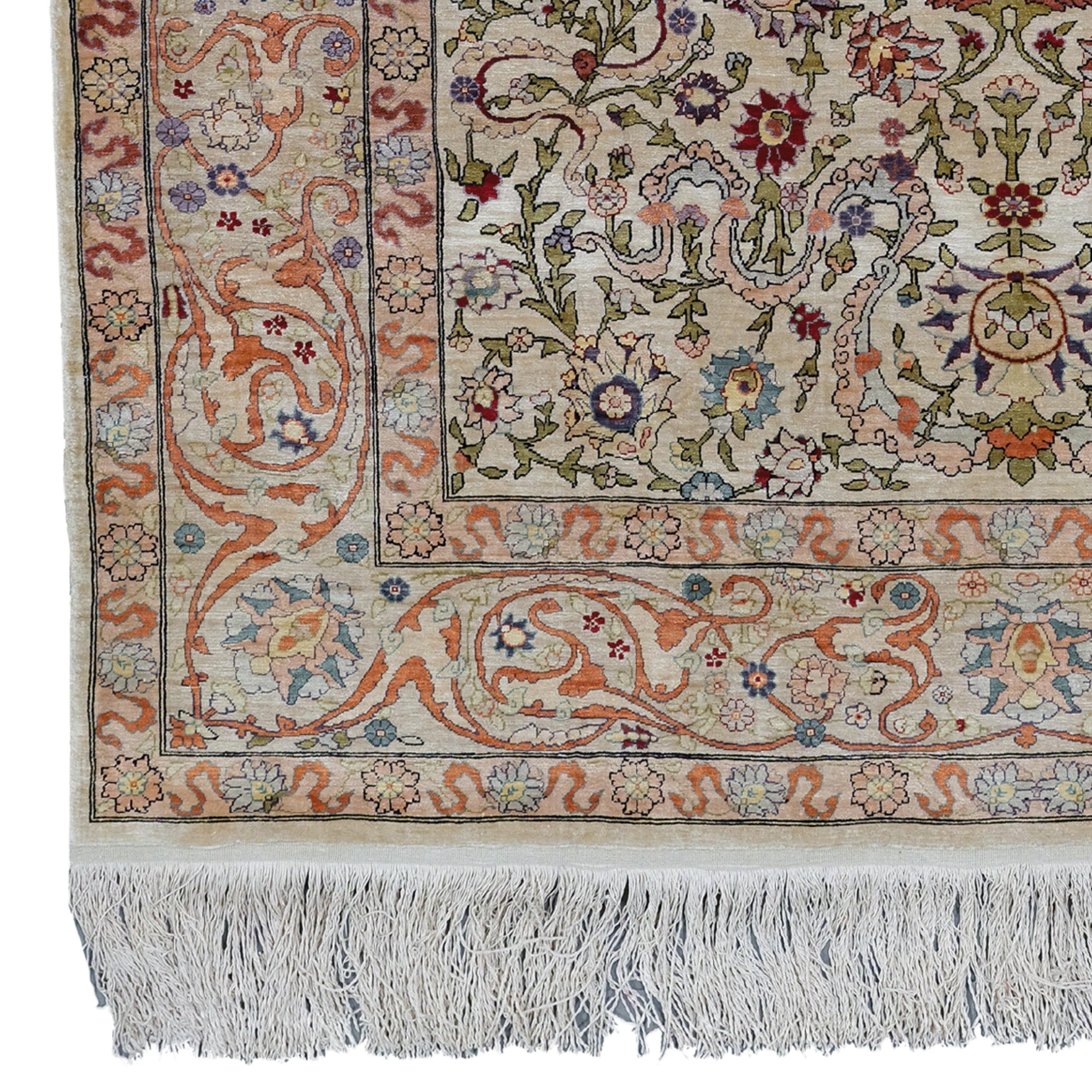 Antique Hereke Silk Rug  Vintage Silk Rug
20th Century Turkish Hereke Silk Rug

This magnificent carpet is a masterpiece, every inch of which is woven with precision and care, telling the rich cultural texture of the period. Its intricate patterns