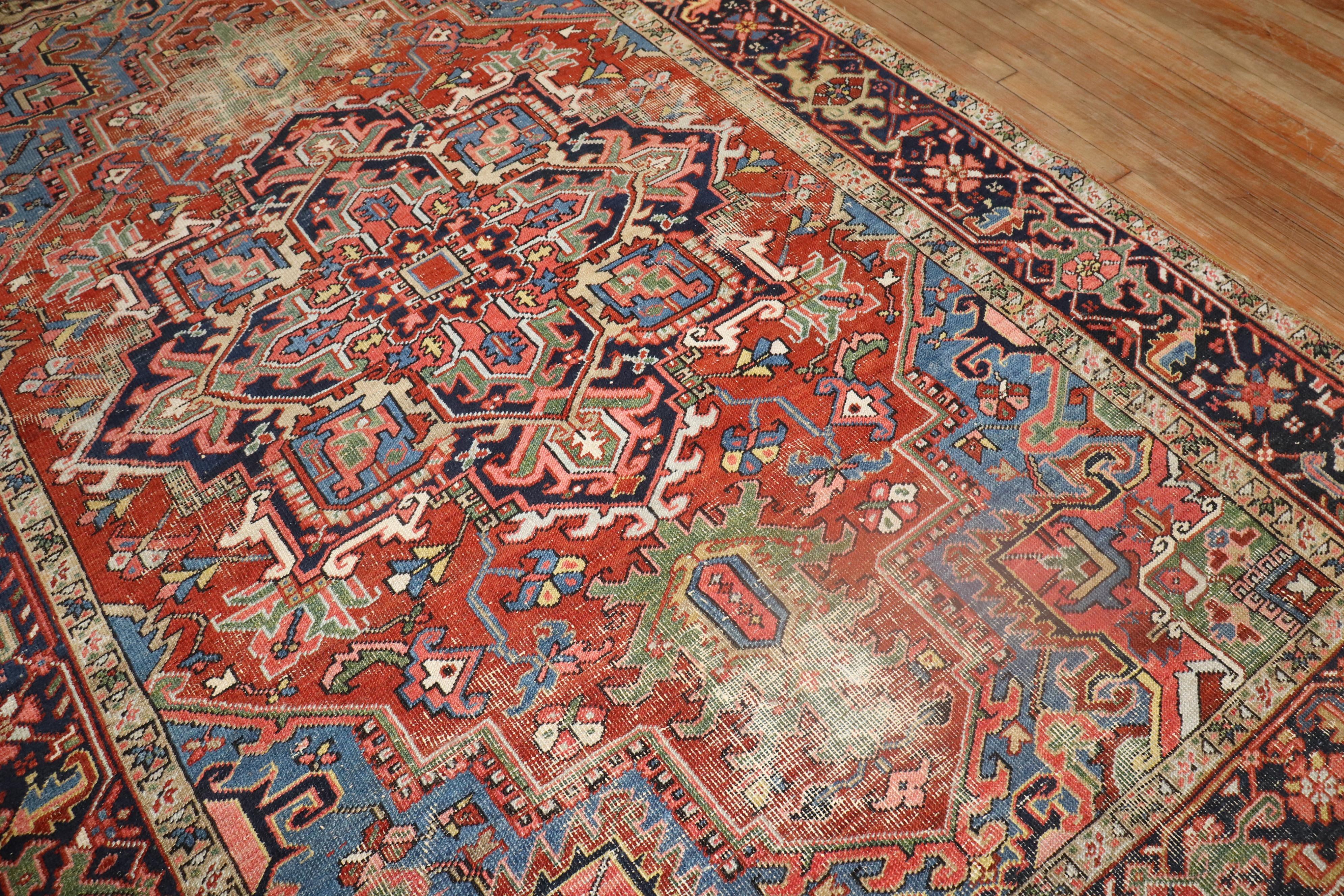 A rare intermediate size early 20th Century Persian Heriz  Rug

6'6'' x 9'6''

With distinctive large scale motifs and a wide ranging palette of warm colors, the antique Heriz carpet is probably the most popular of the Persian village carpets. In