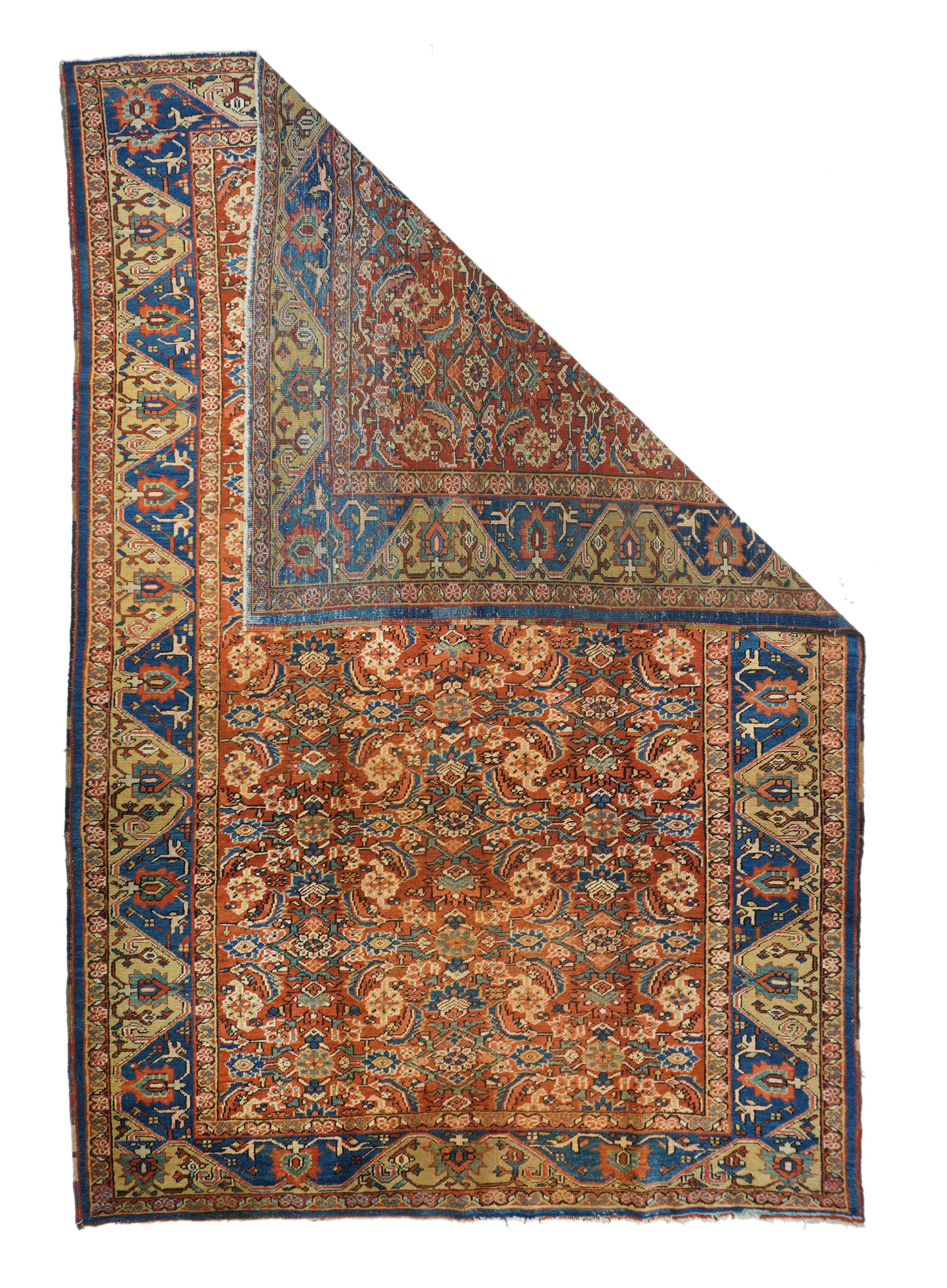 Antique Heriz 7'7'' x 11'8''. The red field uniformly displays an allover four column Herati design of palmettes, rosettes, curved leaves and open lozenges, accented in navy, cream and rust. Straw and mid-blue reciprocal trapezoid border with