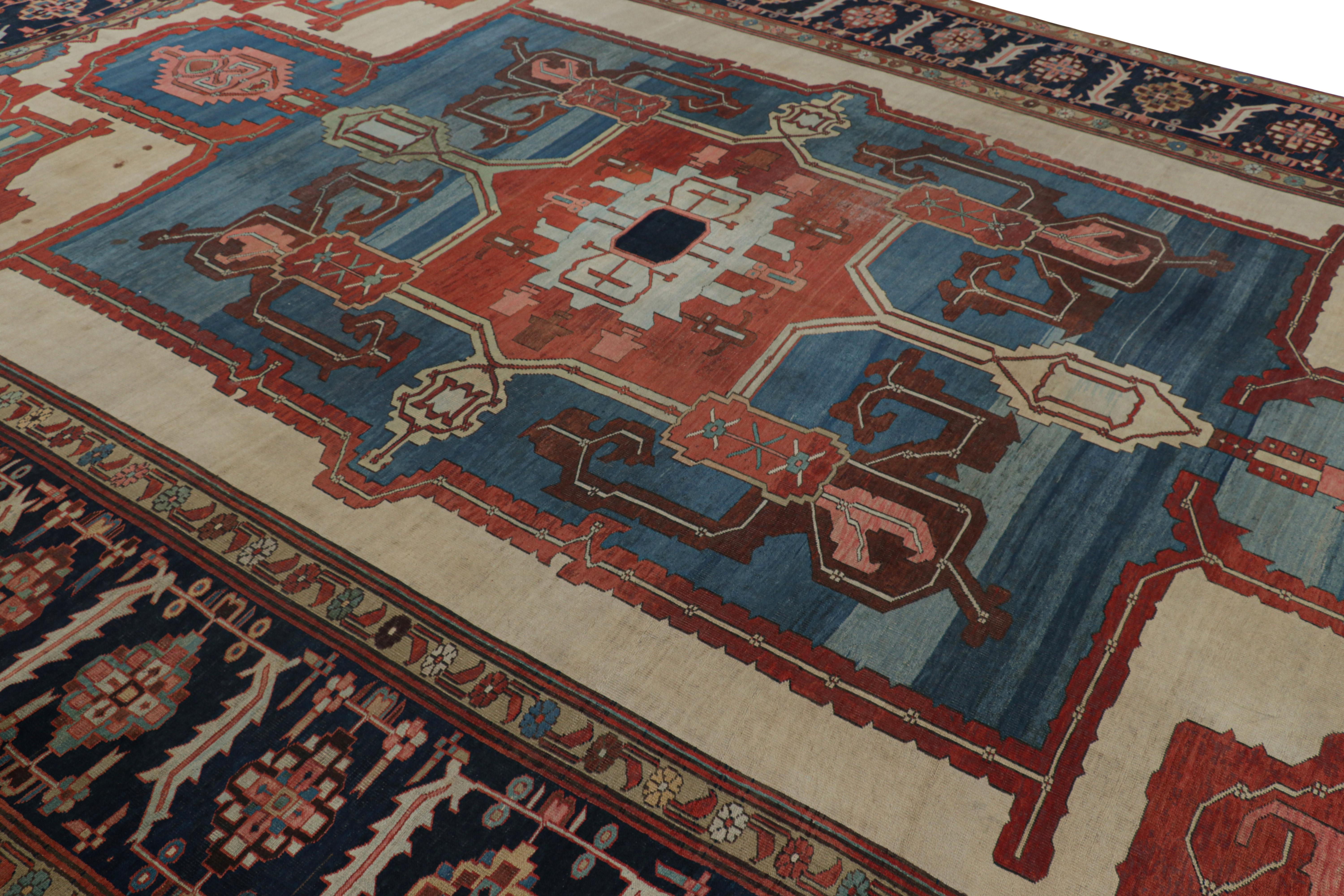 Hand-knotted in wool and originating circa 1910-1920, this 11x16 antique Persian Heriz Bakshaish rug is a particularly special find—among the few of Heriz provenance in this large size and scale, with the most exemplary colors and sharp detail for a
