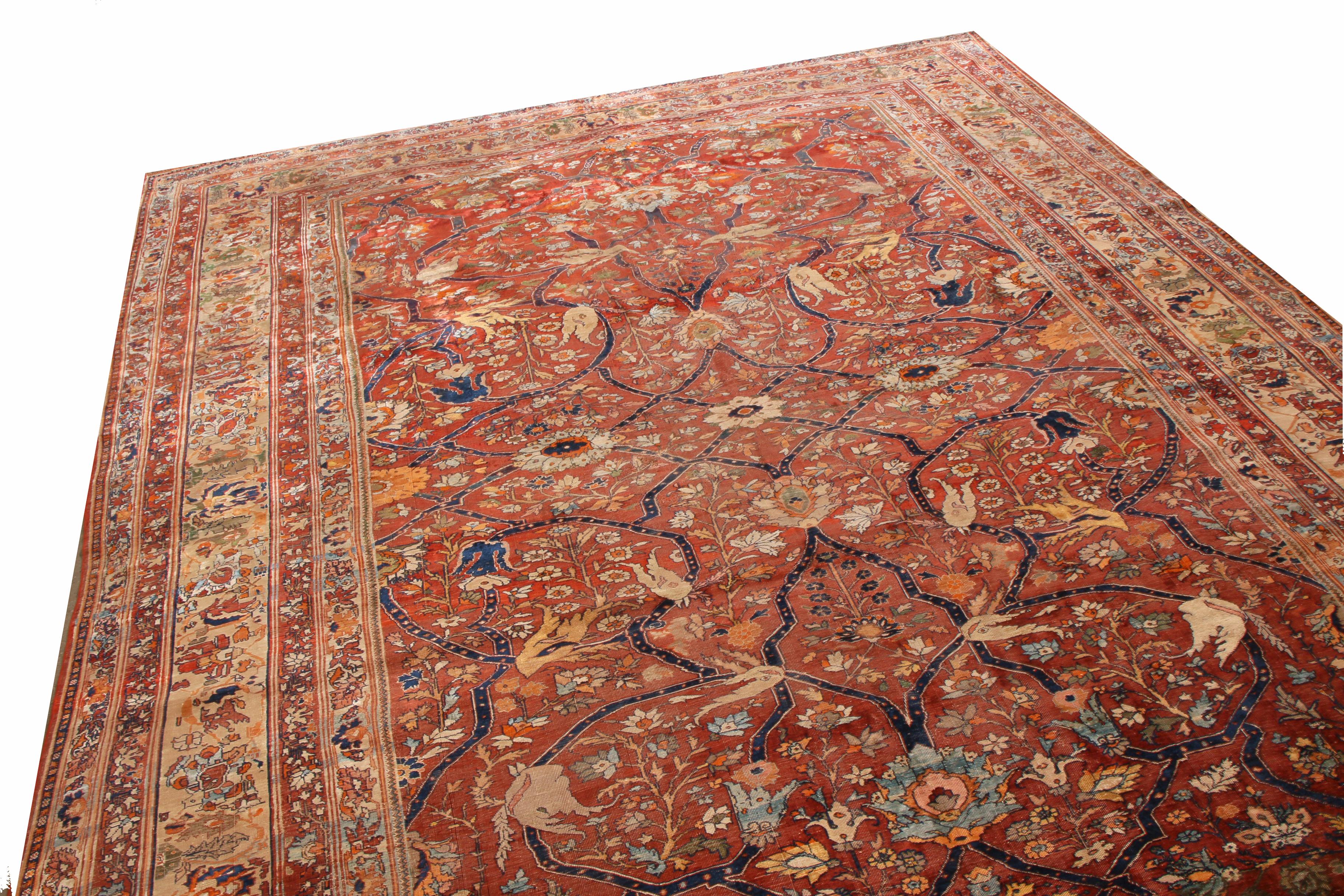 Hand knotted in high quality wool originating from Persia in 1880, this antique Tabriz transitional wool rug features lotus and palmette floral motifs in an all-over field design, representing eternity and rejuvenation in autumnal burgundy brown and