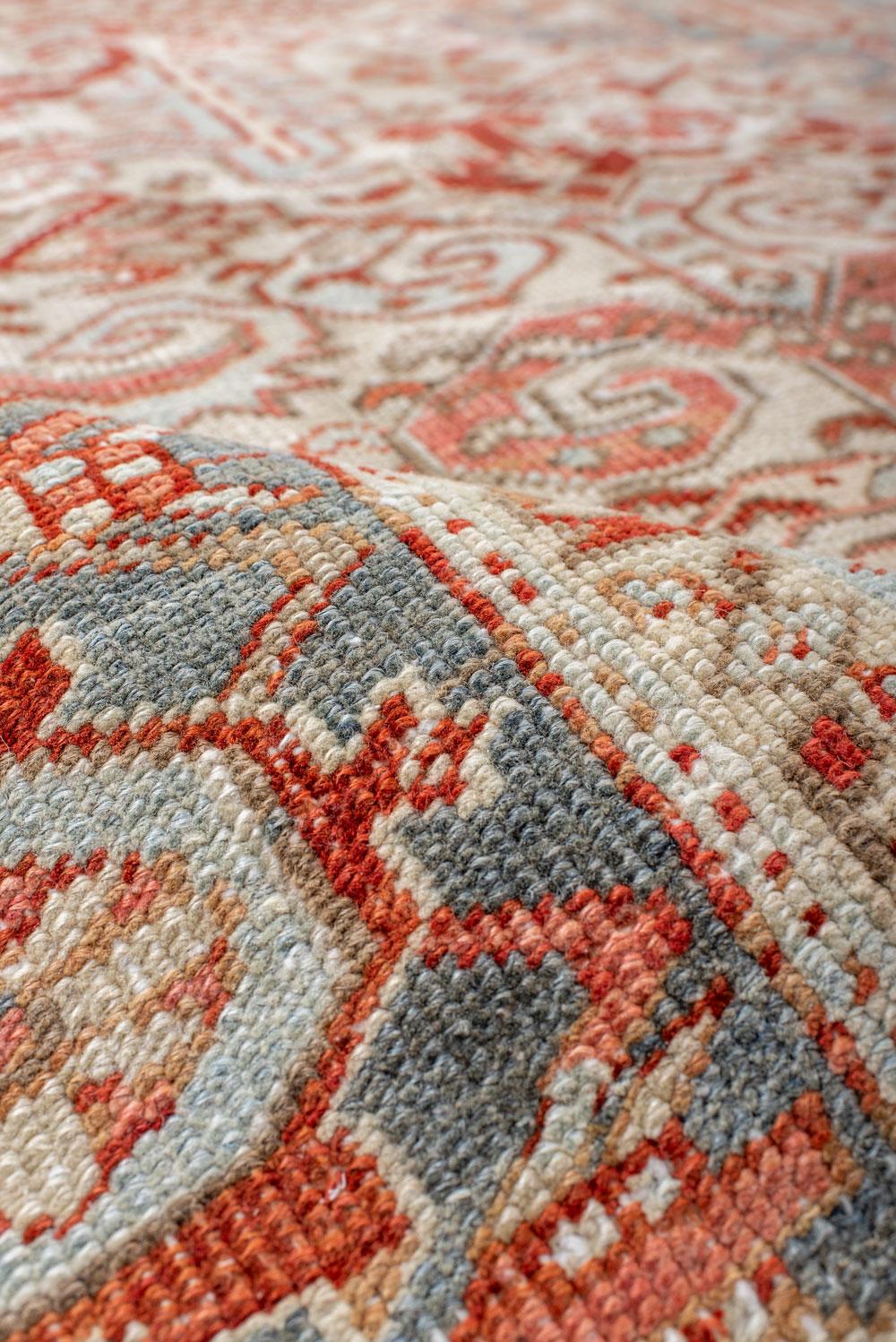 Wool Antique Heriz Carpet Featuring an Array of Rosettes and an Open Medallion For Sale