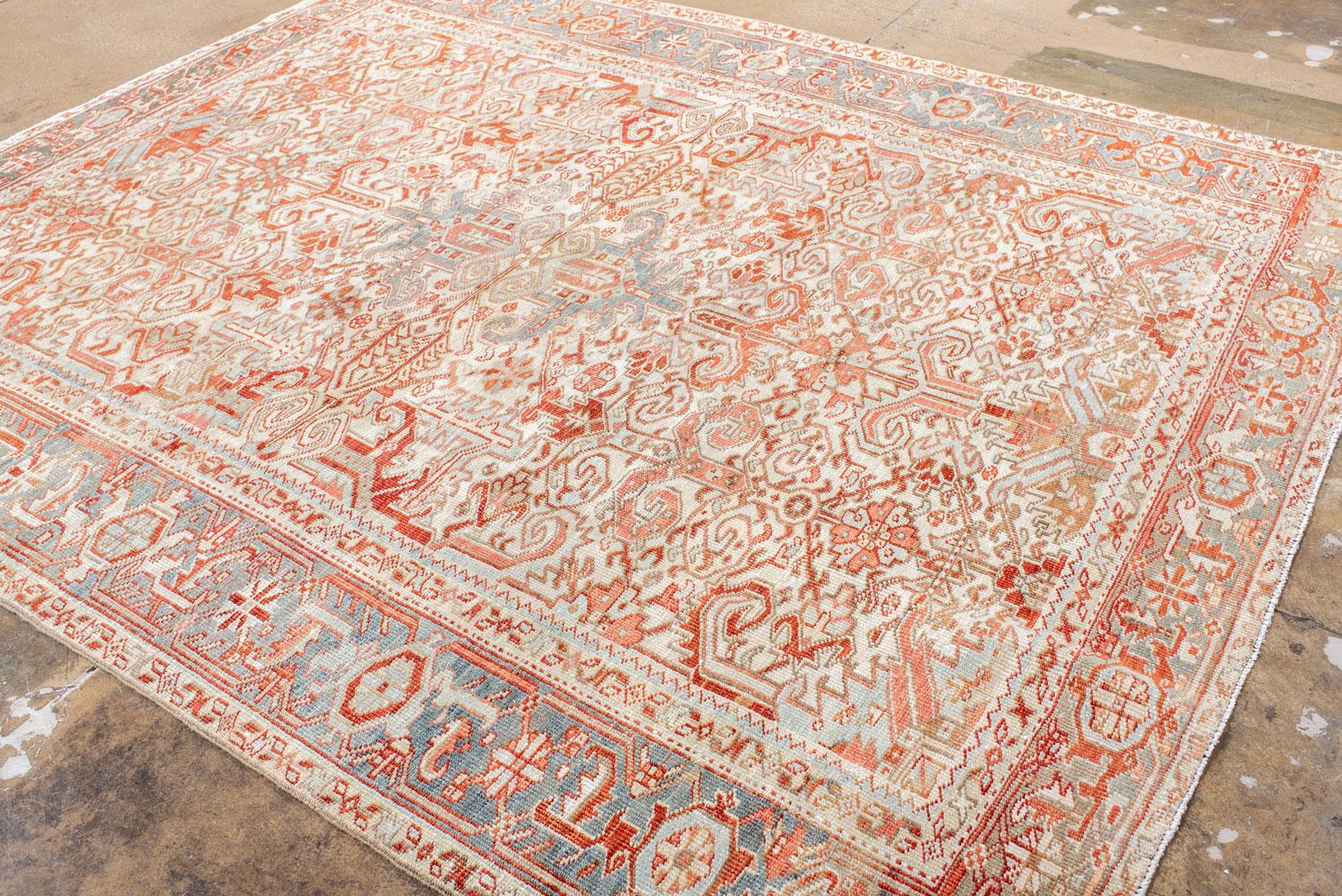 Antique Heriz Carpet Featuring an Array of Rosettes and an Open Medallion For Sale 1