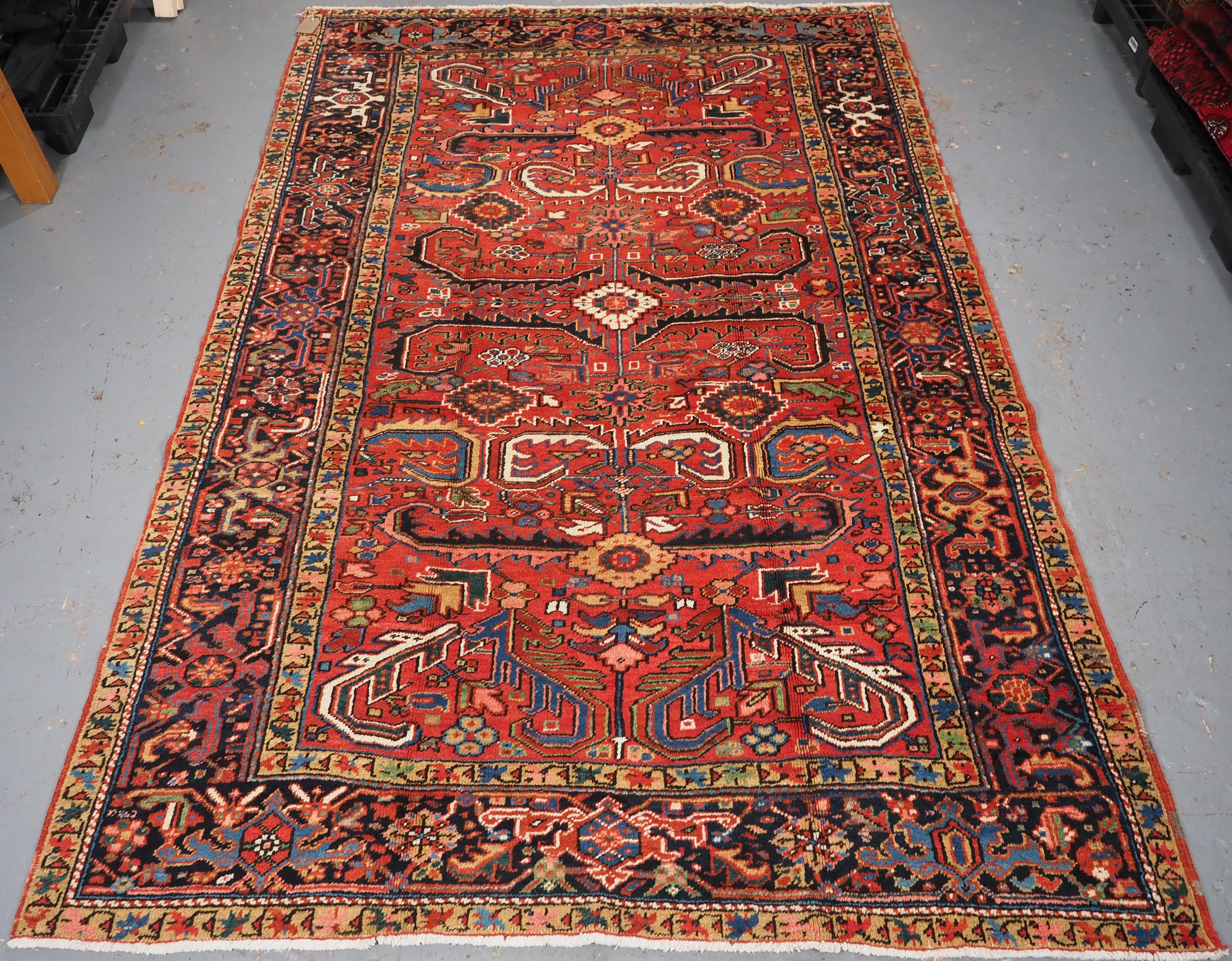 Asian Antique Heriz carpet with a traditional all over design, circa 1910. For Sale