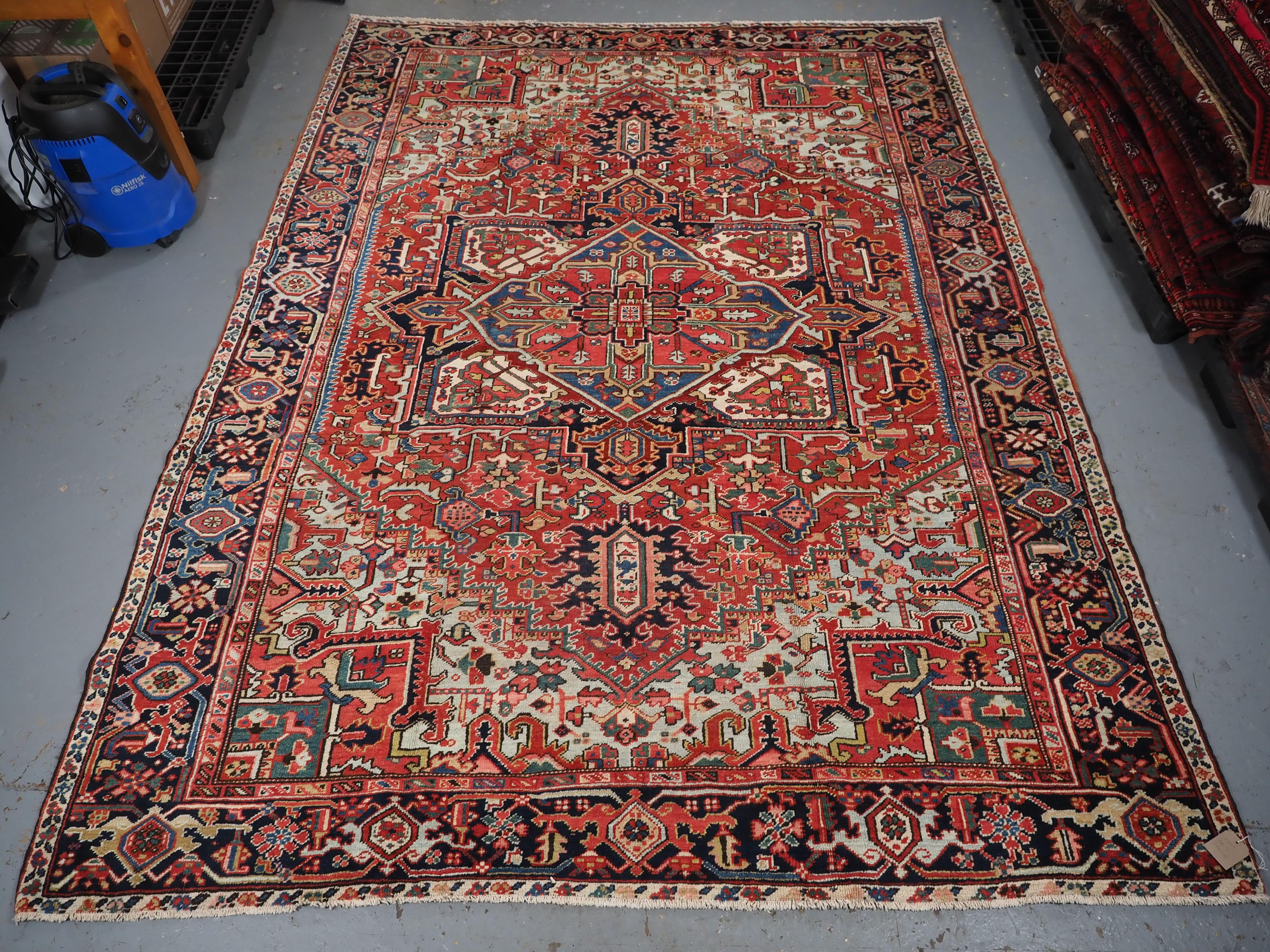 
Size: 11ft 6in x 8ft 7in (350 x 262cm).

Antique Heriz carpet with a very well-drawn large medallion and excellent colours.

Circa 1900.

The carpet has a large central medallion of traditional Heriz design, the ground colour is a superb warm