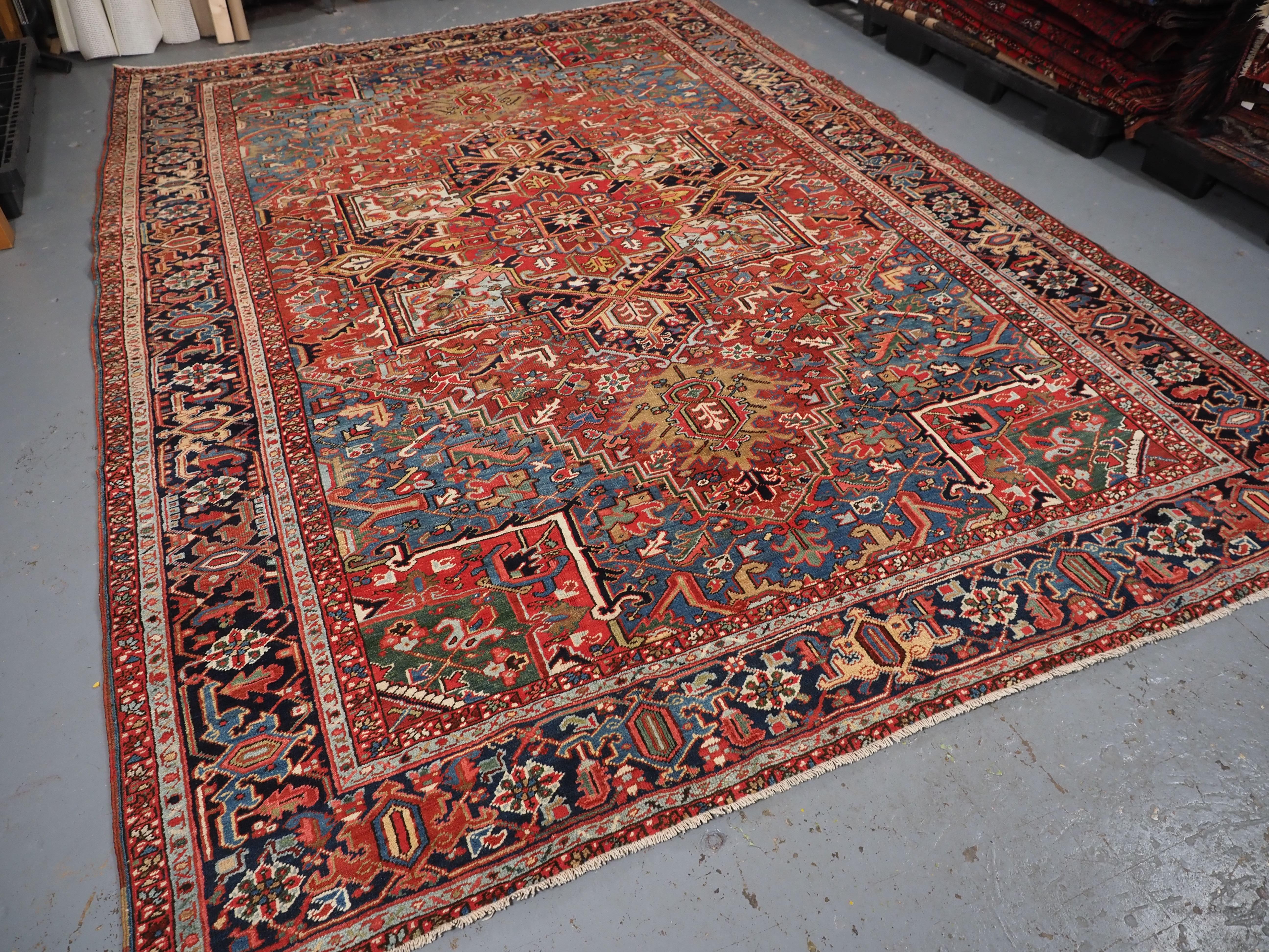 Early 20th Century Antique Heriz carpet with a very well-drawn large medallion, circa 1900. For Sale
