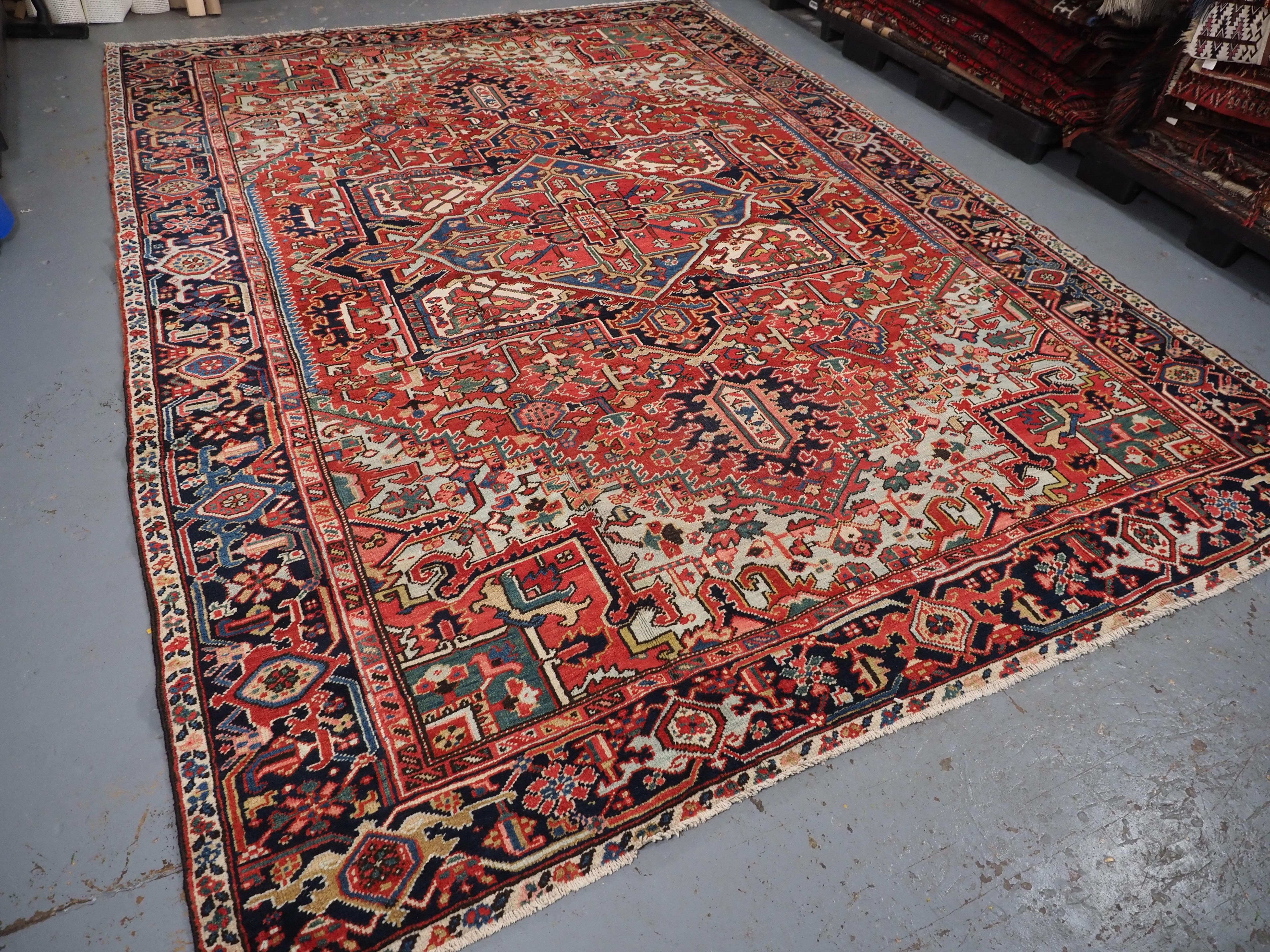 Early 20th Century Antique Heriz carpet with a very well-drawn large medallion, circa 1900. For Sale