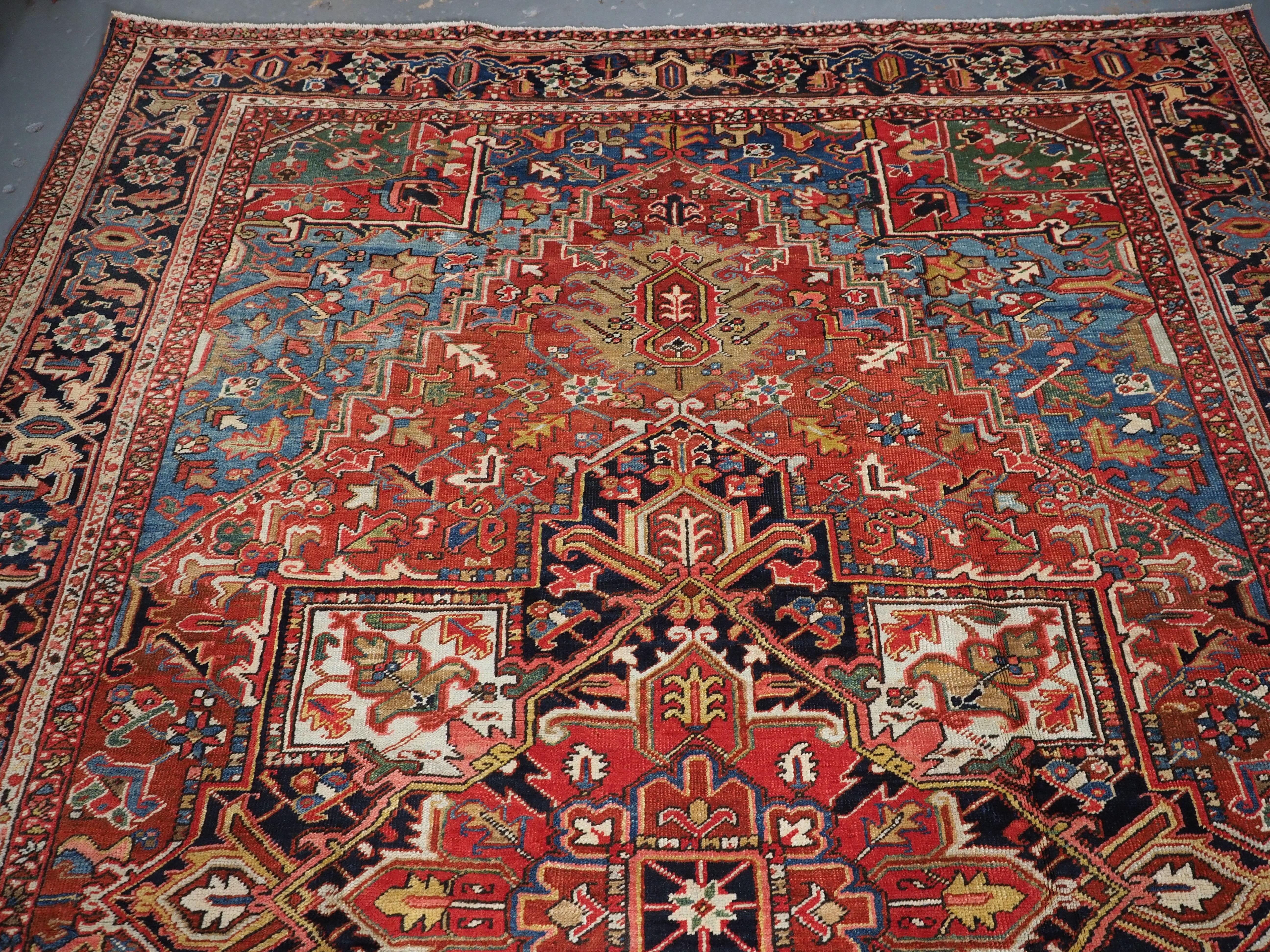 Wool Antique Heriz carpet with a very well-drawn large medallion, circa 1900. For Sale
