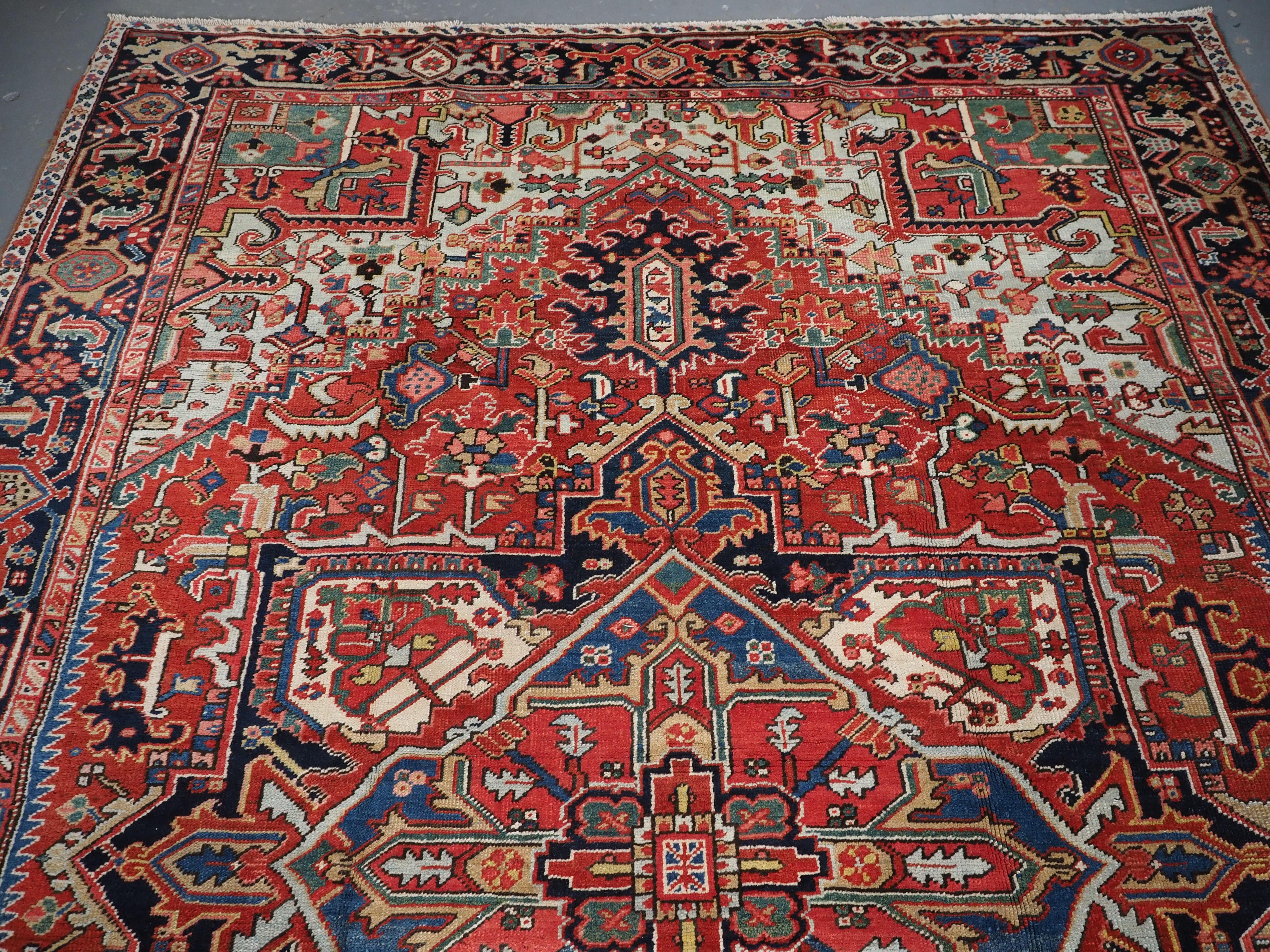 Wool Antique Heriz carpet with a very well-drawn large medallion, circa 1900. For Sale