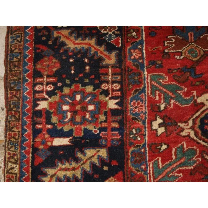 Asian Antique Heriz Carpet with Large Medallion on Madder Red Field For Sale