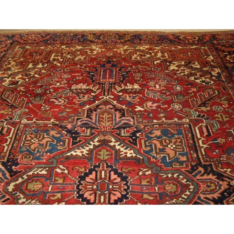 Antique Heriz Carpet with Large Medallion on Madder Red Field In Excellent Condition For Sale In Moreton-In-Marsh, GB