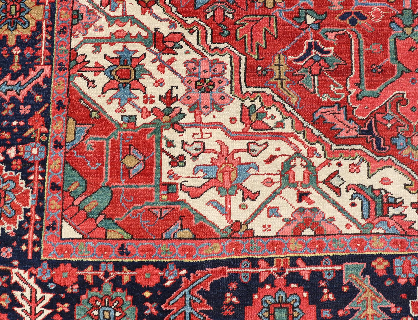 20th Century Antique Heriz Carpet with Stylized Central Medallion Set on Tomato Red Field For Sale