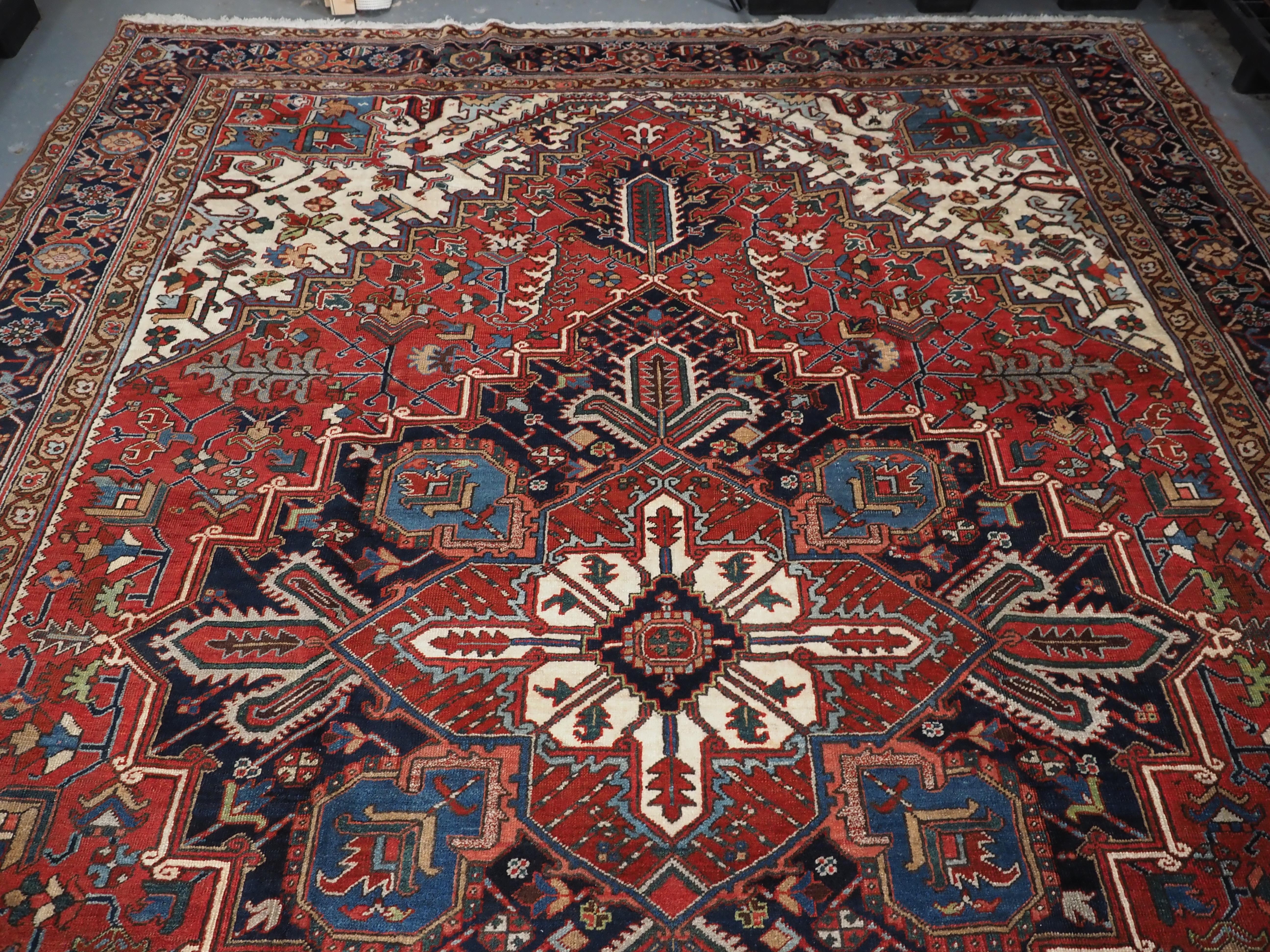 Early 20th Century Antique Heriz carpet with traditional large medallion design, circa 1920 For Sale