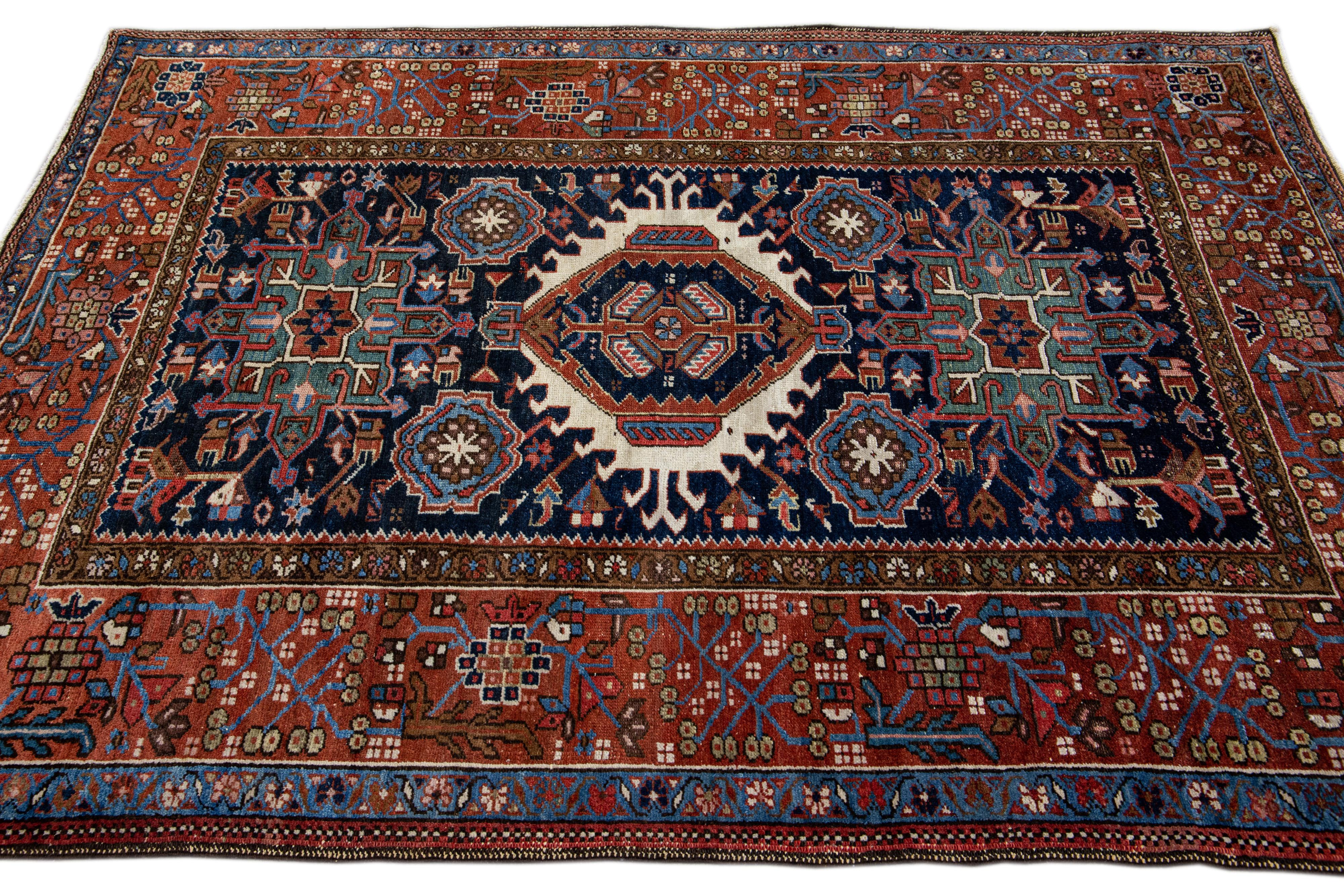 Hand-Knotted Antique Heriz Handmade Medallion Blue and Red Wool Rug For Sale